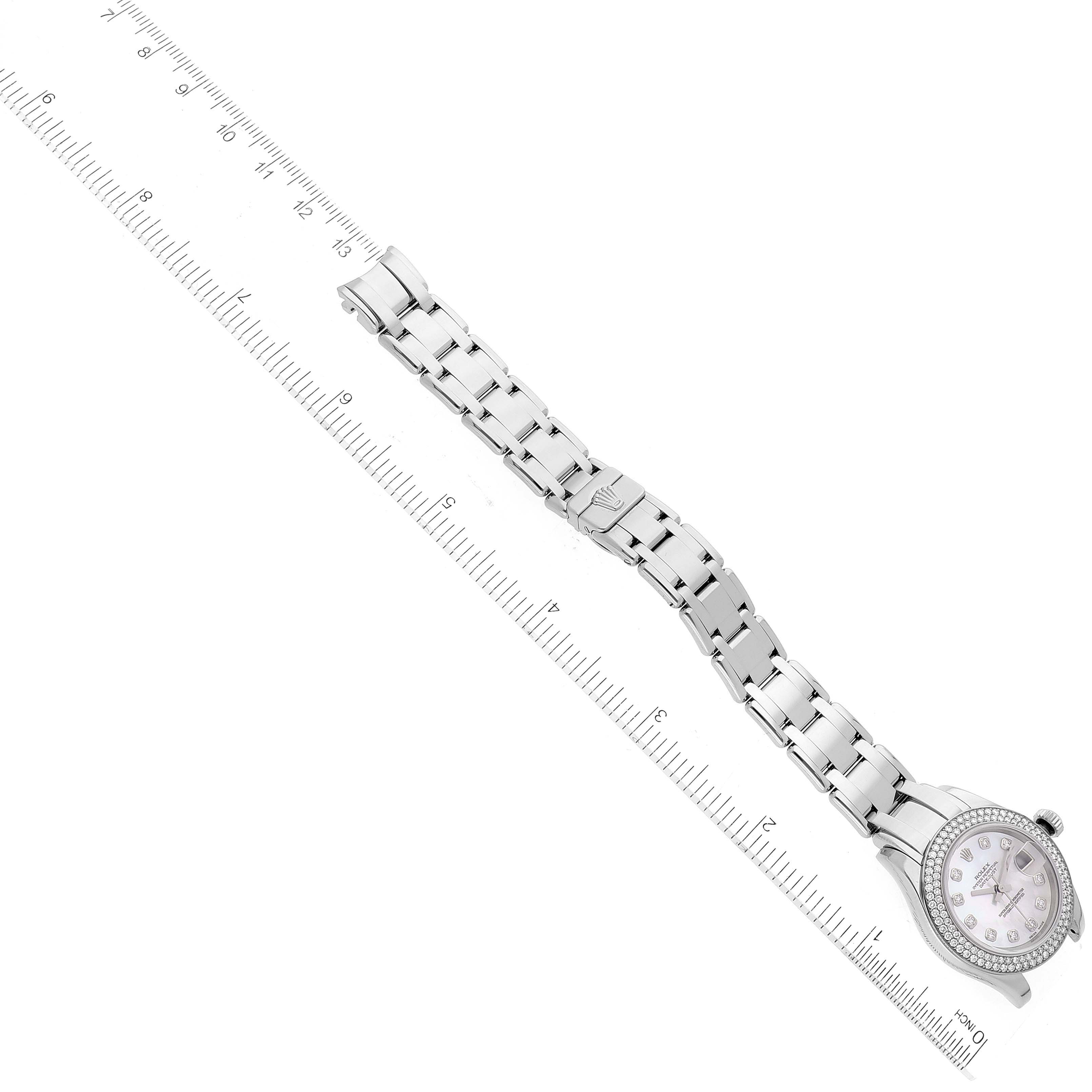 The image shows a Pearlmaster model by Rolex from a top-down angle, displaying the watch face, bracelet, and clasp next to a ruler.