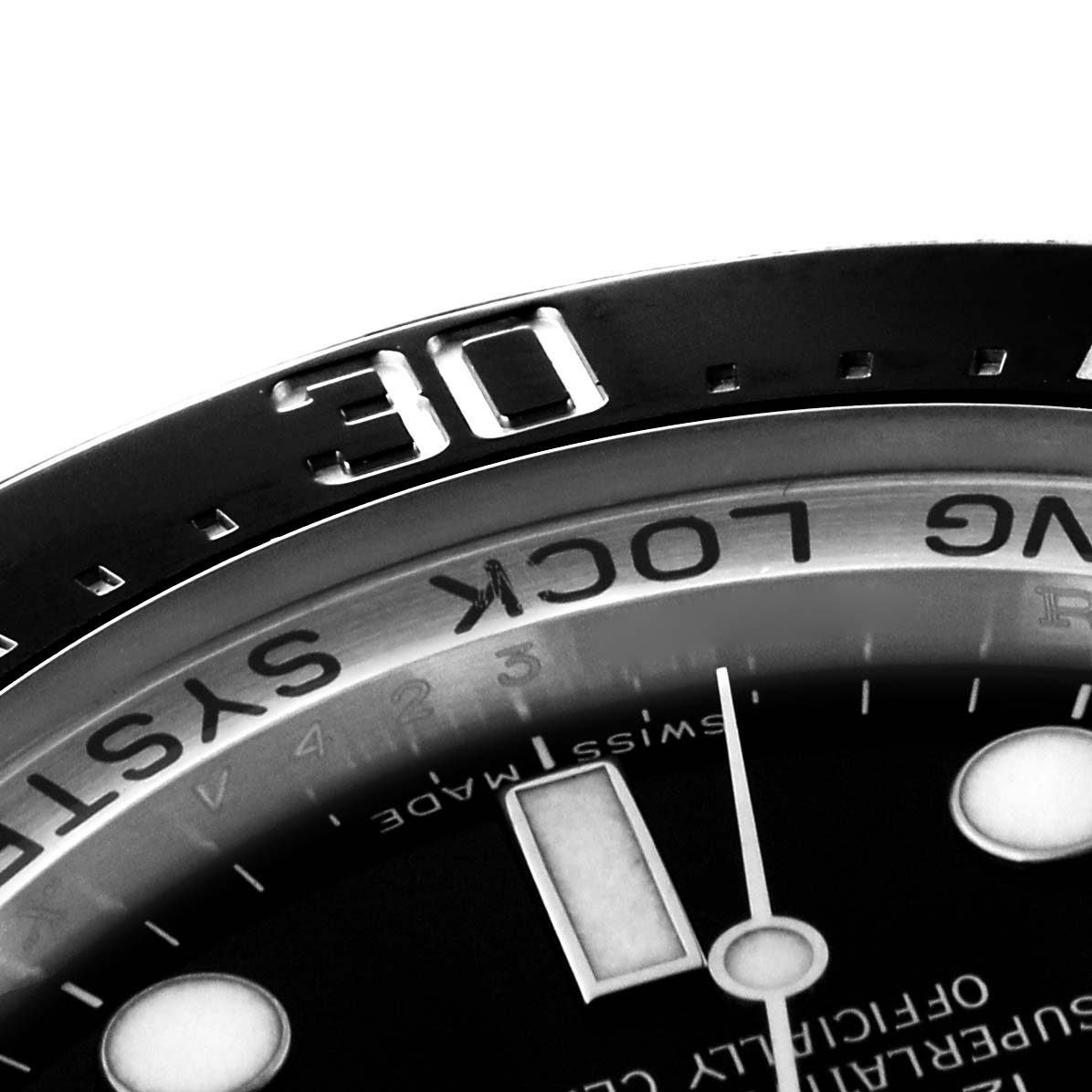 This close-up image of the Rolex Sea-Dweller 116660 Men
s Stainless Steel Black Dial 116660 Men
s Stainless Steel Black Dial watch shows part of the bezel and the dial with the "RING LOCK SYSTEM" text.