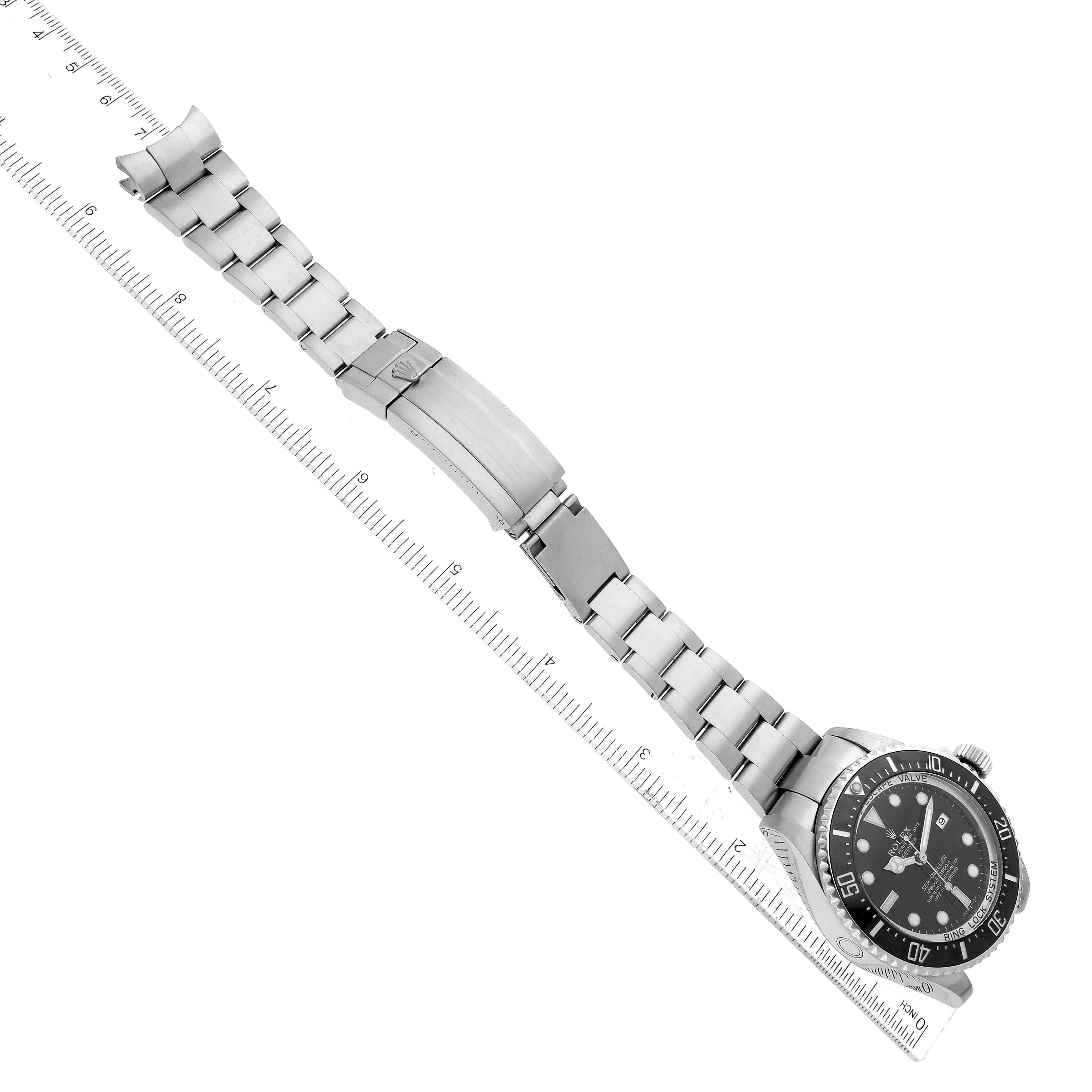 The image shows a top-down view of a Rolex Sea-Dweller 116660 Men
s Stainless Steel Black Dial 116660 Men
s Stainless Steel Black Dial watch, displaying its face, bezel, and full bracelet with the clasp open.