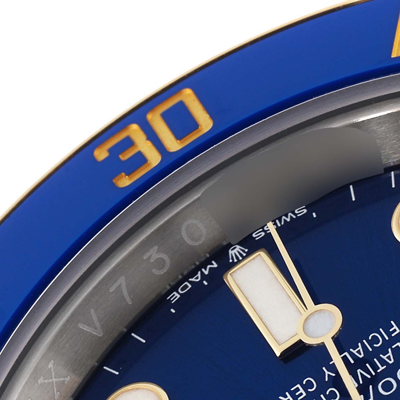 This image shows a close-up of the blue bezel marked "30" and part of the blue dial of the Rolex Submariner 126613 Men
s Steel and Gold (two tone) Blue Dial 126613 Men
s Steel and Gold (two tone) Blue Dial model.