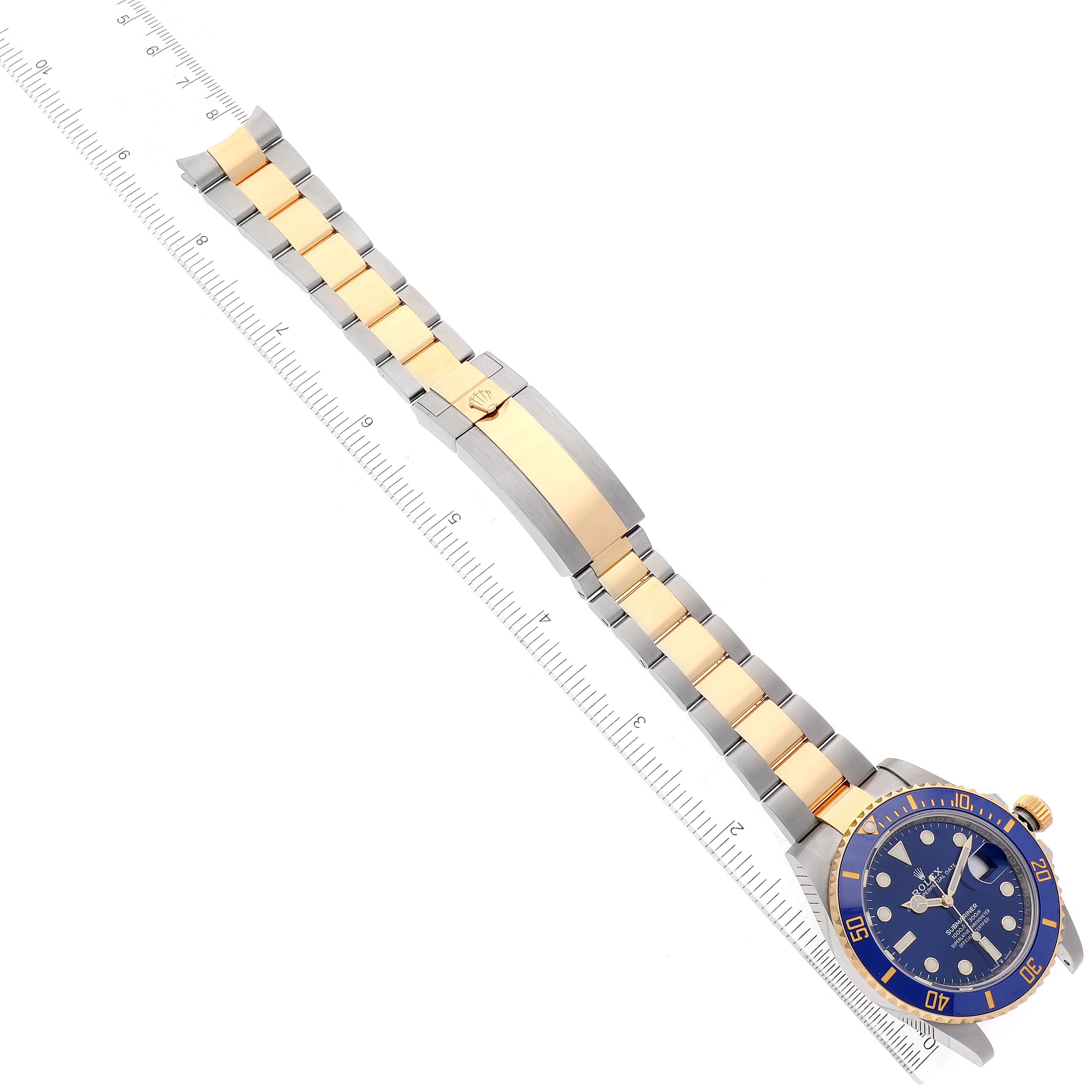The image shows a top-down view of a Rolex Submariner 126613 Men's Steel and Gold (two tone) Blue Dial 126613 Men's Steel and Gold (two tone) Blue Dial watch, displaying its blue dial, bezel, and two-tone bracelet.