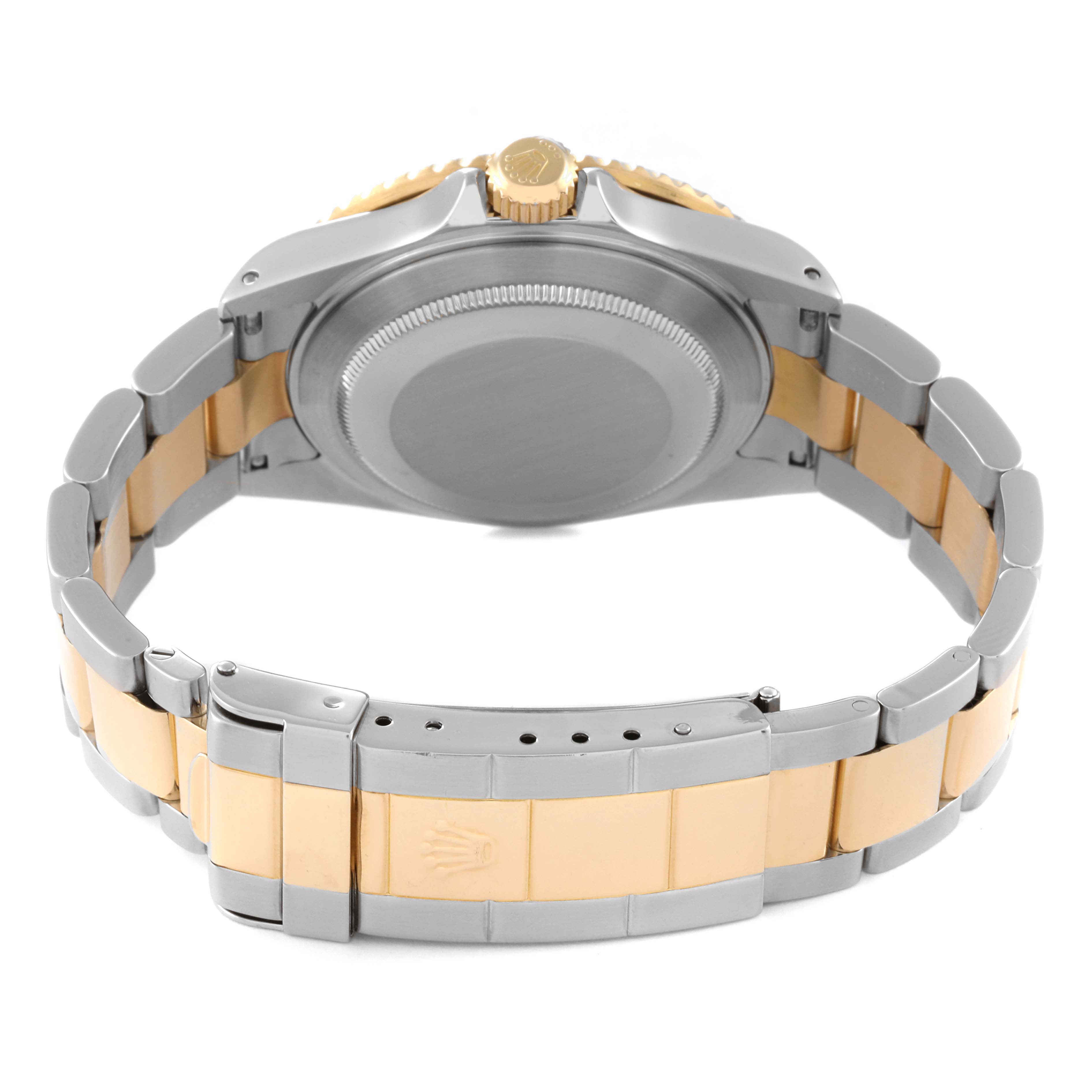 The image shows the back view of a Rolex Submariner 16613 Men's Steel and Gold (two tone) Blue Dial 16613 Men's Steel and Gold (two tone) Blue Dial watch, highlighting the case back and two-tone bracelet.