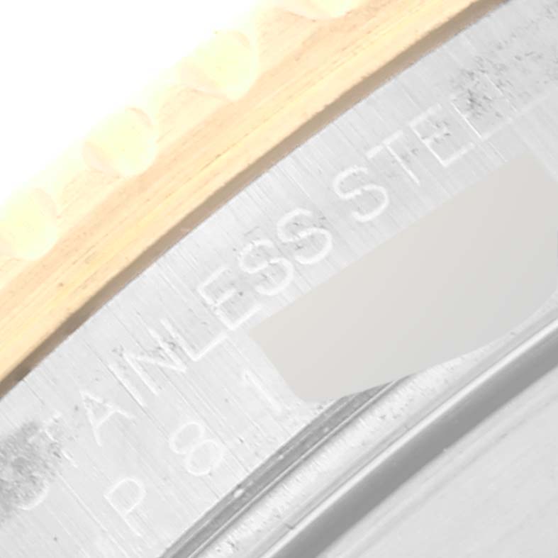 This image shows a close-up of the case back and bezel of a Rolex Submariner 16613 Men's Steel and Gold (two tone) Blue Dial 16613 Men's Steel and Gold (two tone) Blue Dial, highlighting the stainless steel engraving.