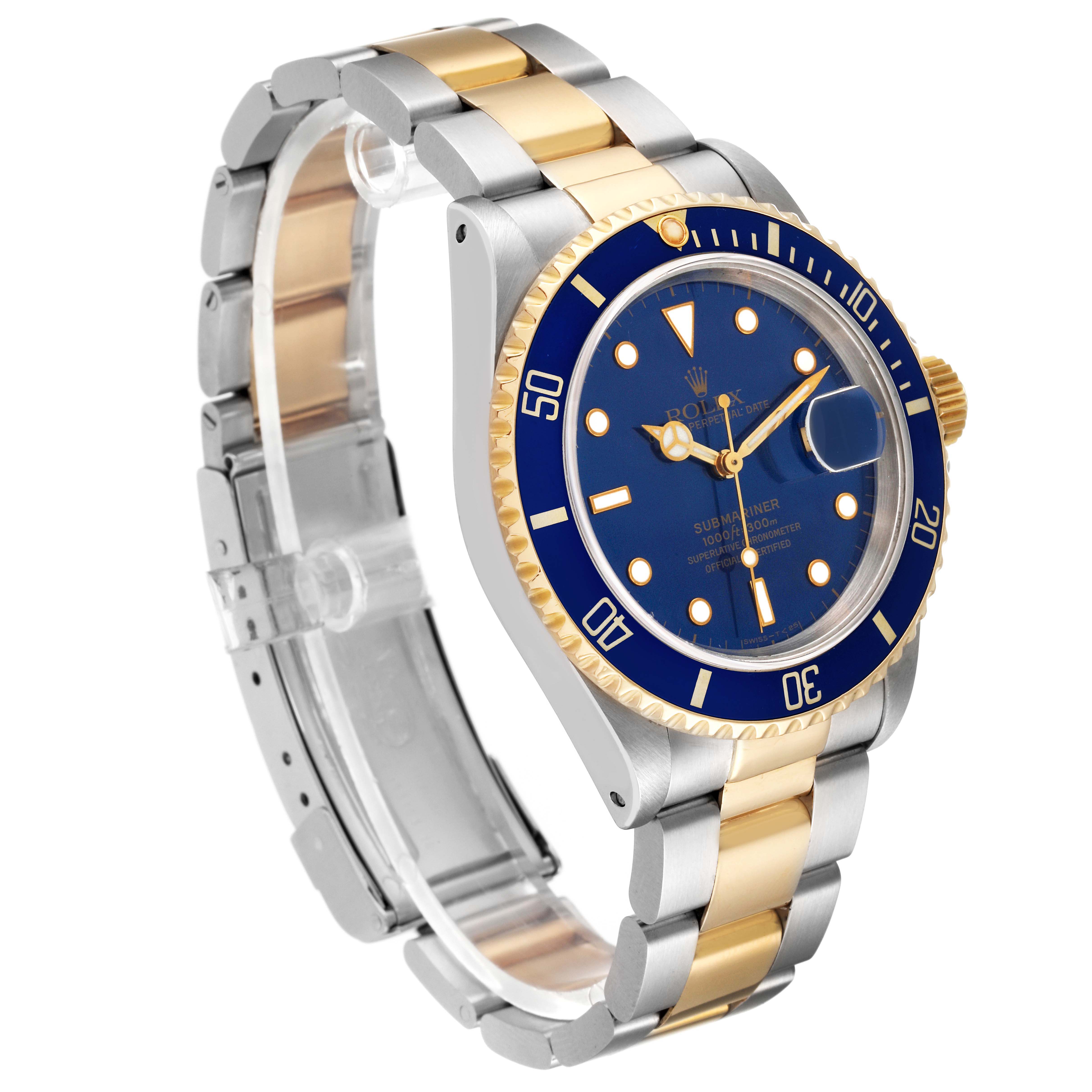 The image shows a Rolex Submariner 16613 Men's Steel and Gold (two tone) Blue Dial 16613 Men's Steel and Gold (two tone) Blue Dial watch at a three-quarter angle, highlighting its blue bezel, dial, and two-tone band.