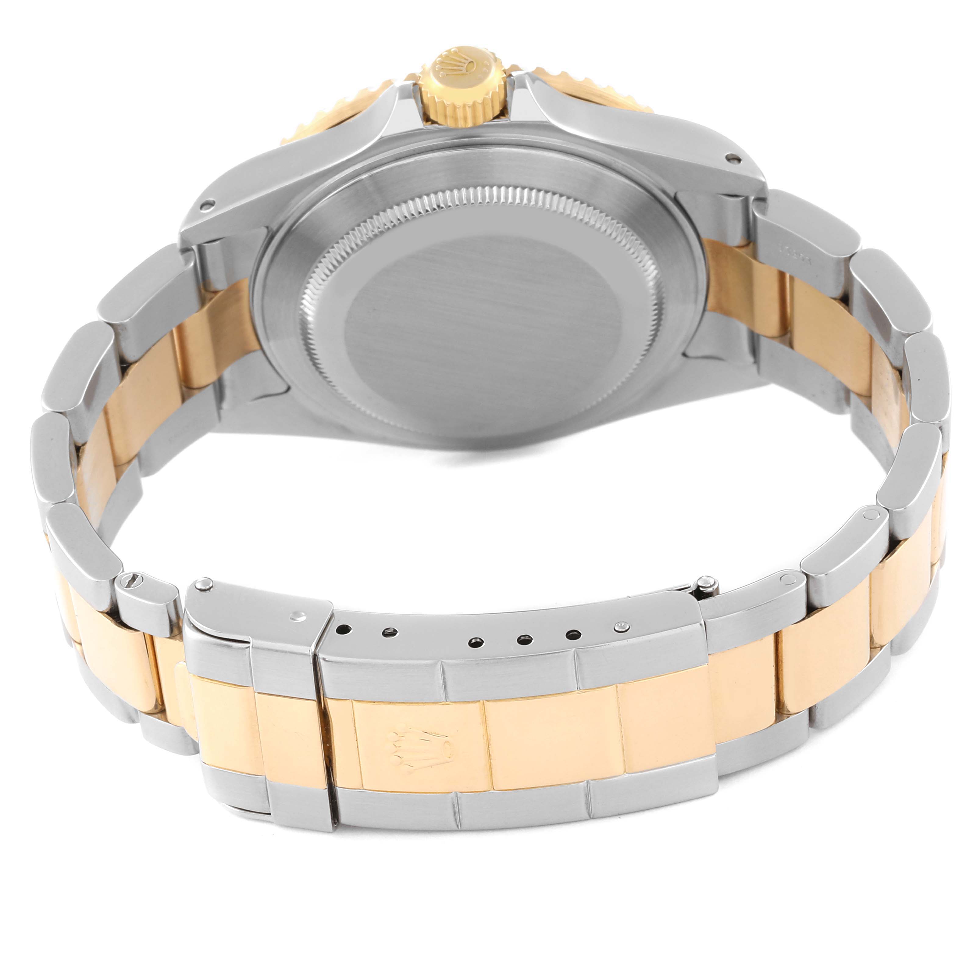 The image shows the back view of a Rolex Submariner 16613 Men's Steel and Gold (two tone) Black Dial 16613 Men's Steel and Gold (two tone) Black Dial, highlighting its case back, bracelet, and clasp.