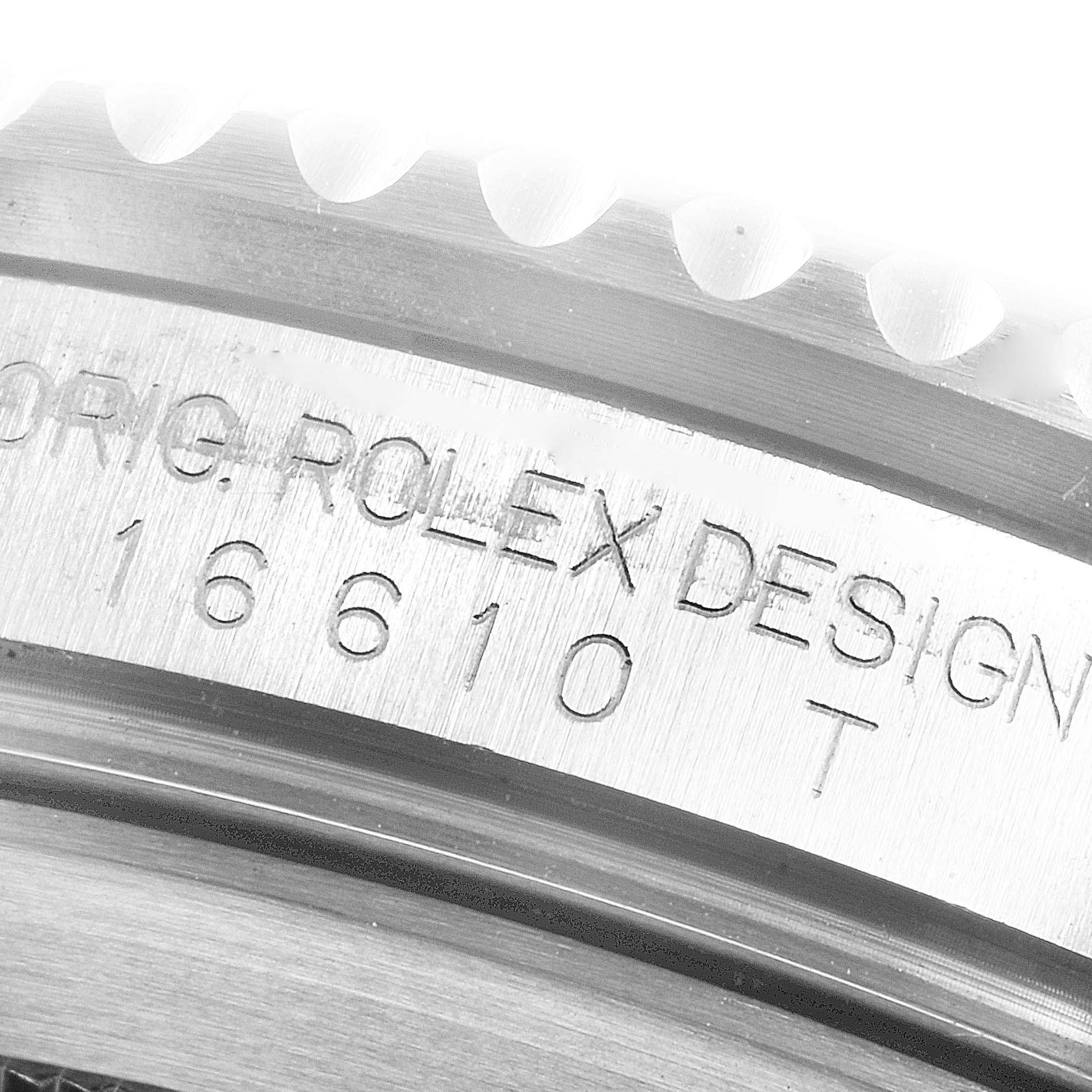 This close-up image shows the engraved model and brand details (Rolex Submariner 16610 Men
s Stainless Steel Black Dial 16610 Men
s Stainless Steel Black Dial) on the watch bezel and inner ring.