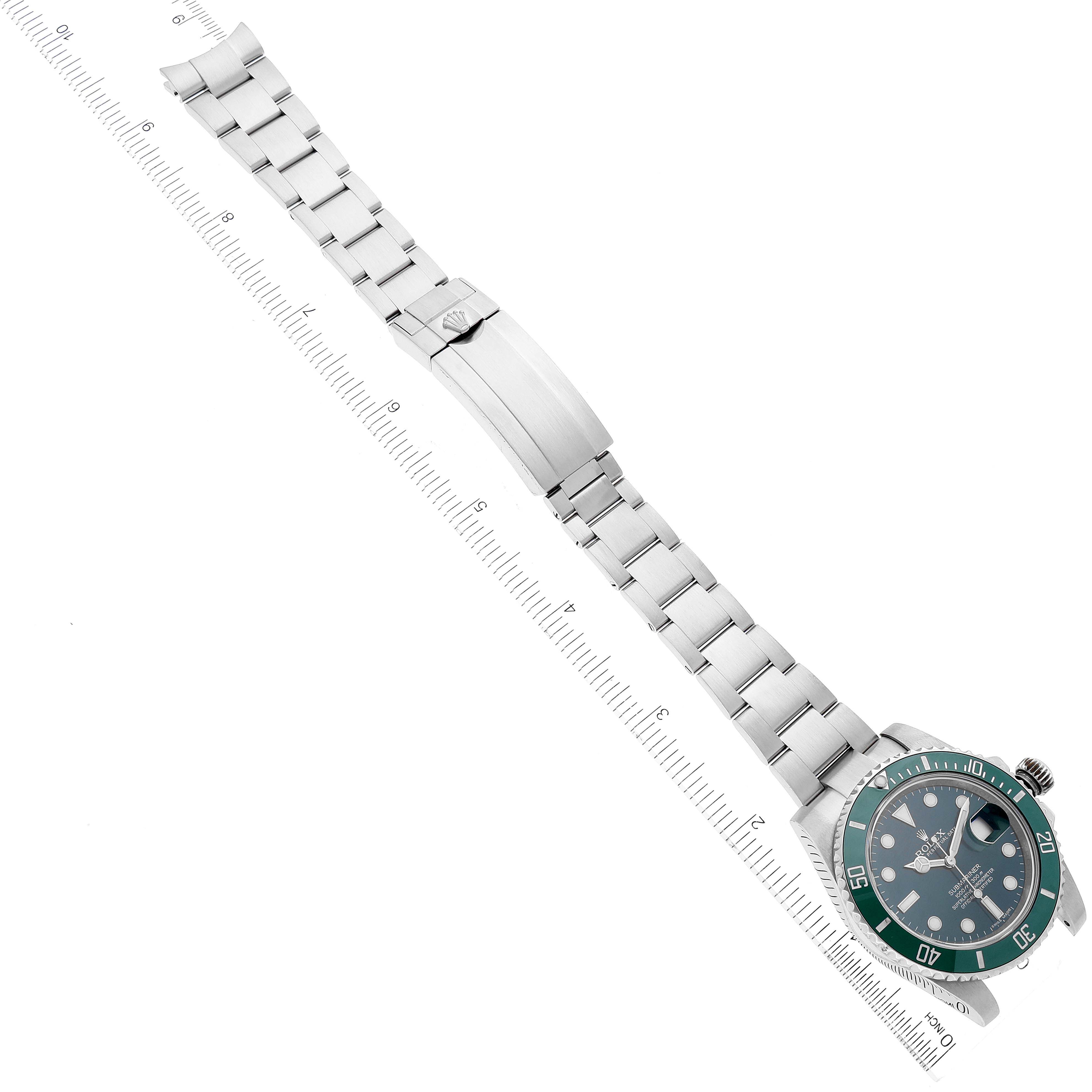 This image shows a top-down view of a Rolex Submariner 116610LV Men
s Stainless Steel Green Dial 116610LV Men
s Stainless Steel Green Dial watch, displaying its face, bezel, and fully extended stainless-steel bracelet with the clasp.