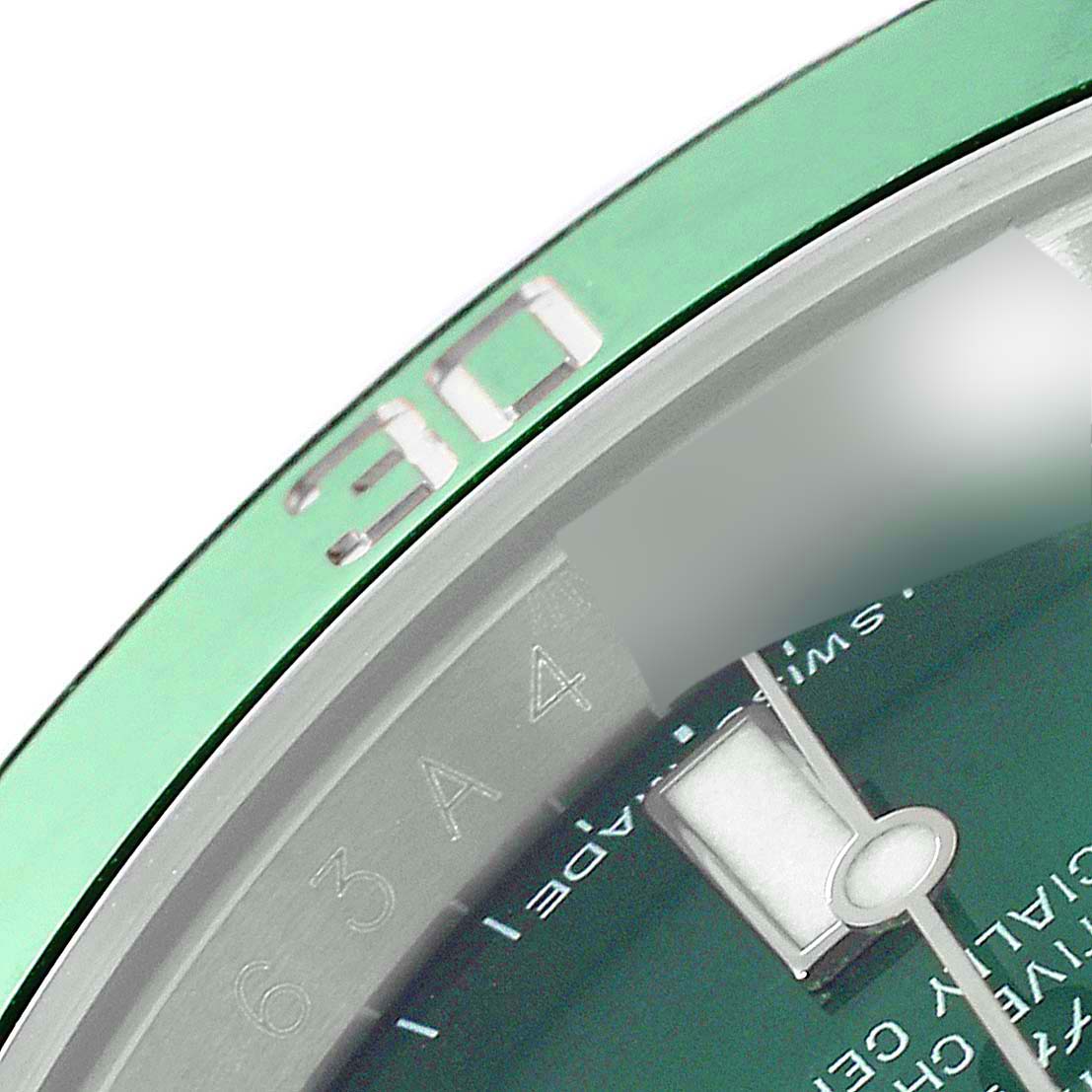 Close-up of the bezel and part of the dial of a Rolex Submariner 116610LV Men
s Stainless Steel Green Dial 116610LV Men
s Stainless Steel Green Dial watch, highlighting the number 30 on the bezel.