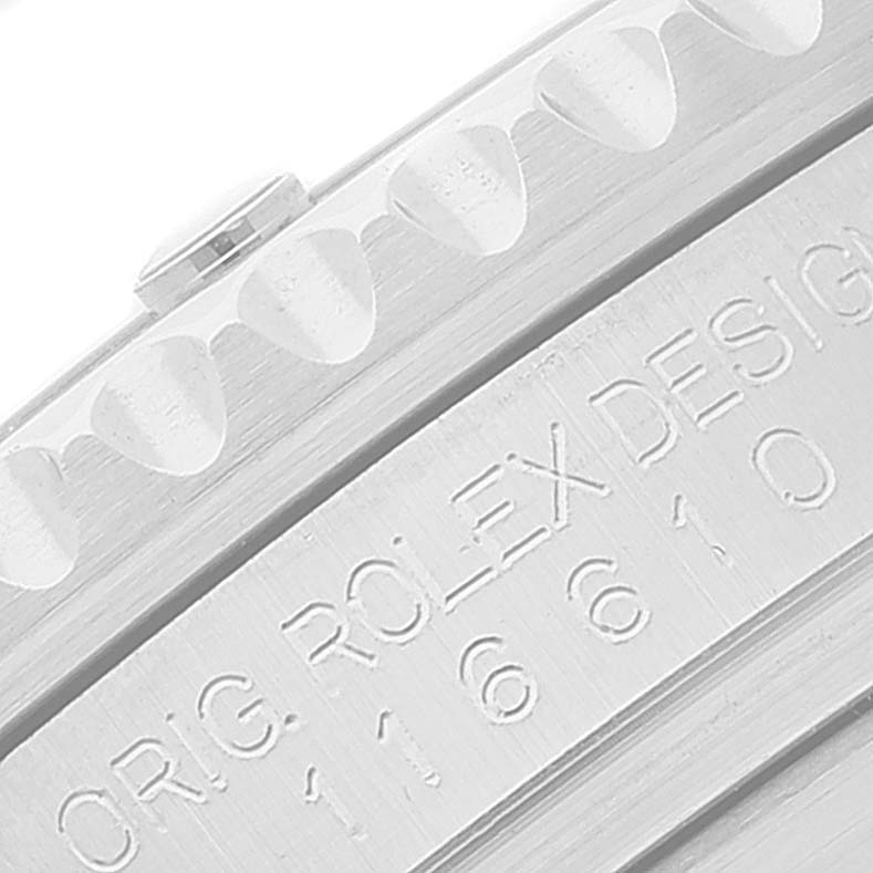 This close-up image shows the engraved bezel and part of the casing of a Rolex Submariner 116610LV Men
s Stainless Steel Green Dial 116610LV Men
s Stainless Steel Green Dial watch.