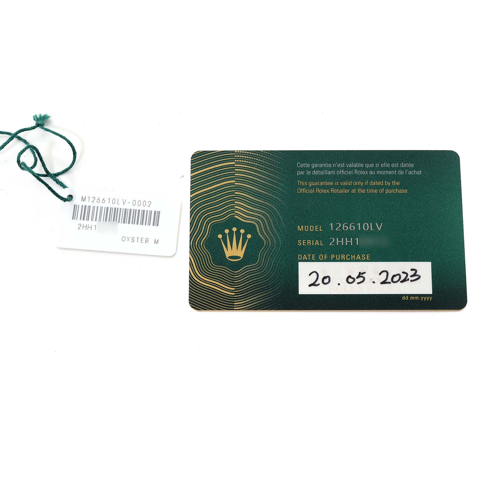 The image shows the warranty card and tag for a Rolex Submariner 126610LV Men's Stainless Steel Black Dial 126610LV Men's Stainless Steel Black Dial model 126610LV.