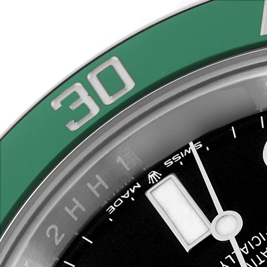 This image shows a close-up of the green bezel, part of the dial, and minute markers of the Rolex Submariner 126610LV Men's Stainless Steel Black Dial 126610LV Men's Stainless Steel Black Dial watch.