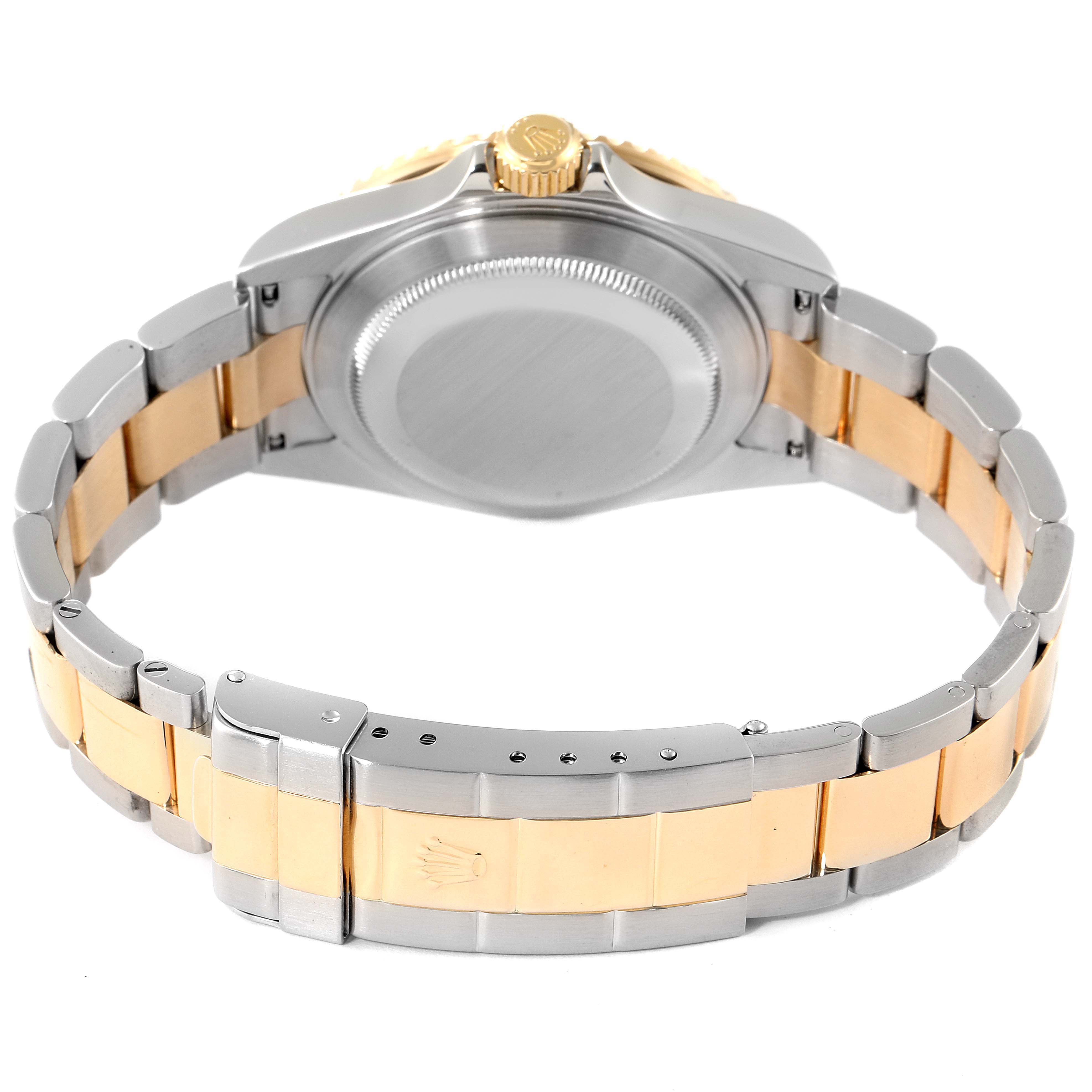 The image shows the back view of a Rolex Submariner 16613 Men's Steel and Gold (two tone) Silver Dial, highlighting its two-tone bracelet and clasp.