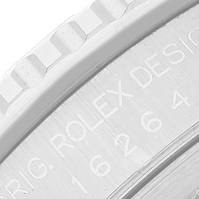This close-up image shows part of the bezel and case of a Rolex Turn-o-Graph 16264 Men
s Stainless Steel Black Dial 16264 Men
s Stainless Steel Black Dial watch, including engraved text and markers.