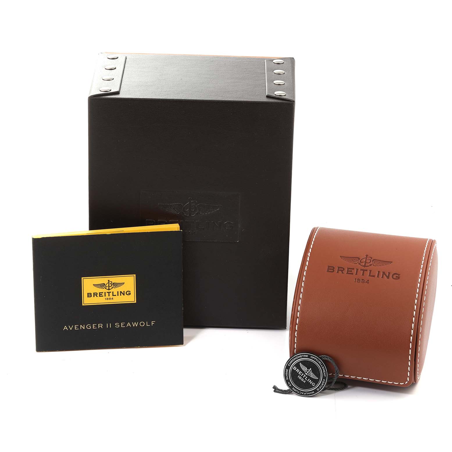 The image shows a Breitling Avenger A17331 Men's Stainless Steel Yellow Dial A17331 Men's Stainless Steel Yellow Dial watch box, a manual labeled "Avenger II Seawolf," and a brown leather case.