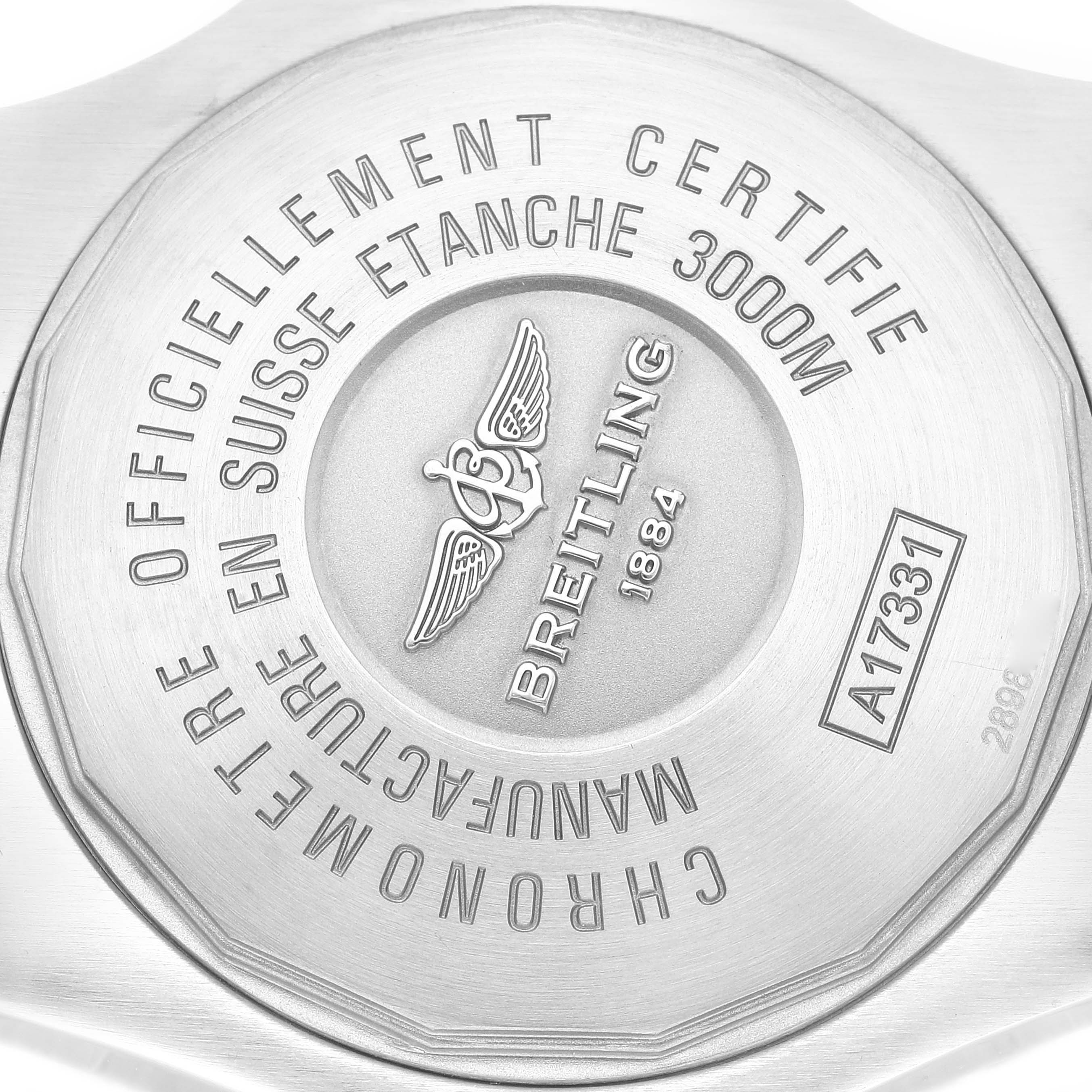 The image shows the backside of the Breitling Avenger A17331 Men's Stainless Steel Yellow Dial A17331 Men's Stainless Steel Yellow Dial watch with inscriptions detailing its certification and water resistance.