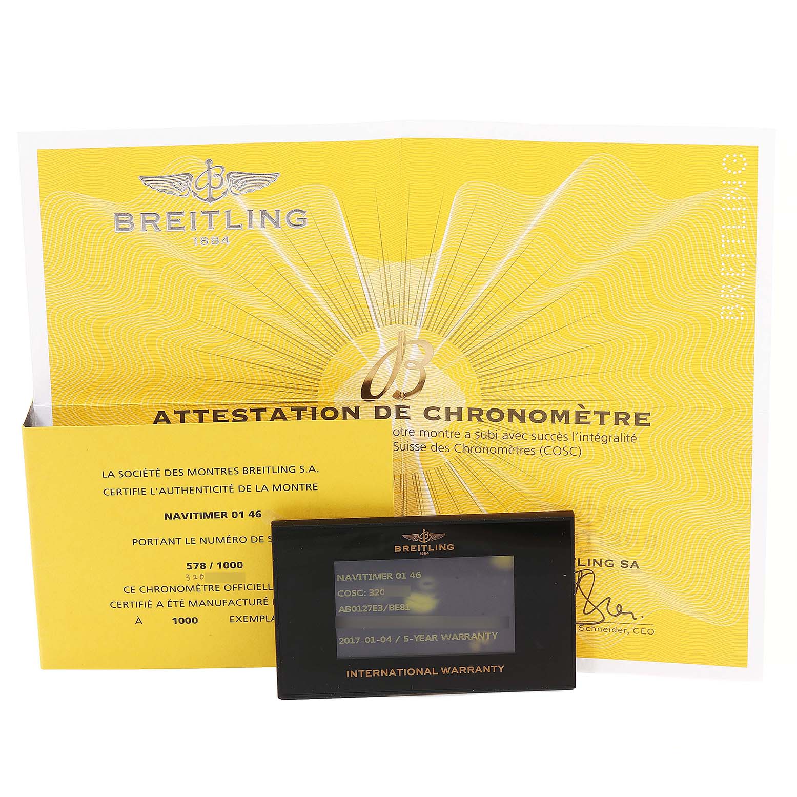 The image shows a Breitling Navitimer AB0127 Men's Stainless Steel Black Dial AB0127 Men's Stainless Steel Black Dial 01 46 certificate with an international warranty card placed in front.