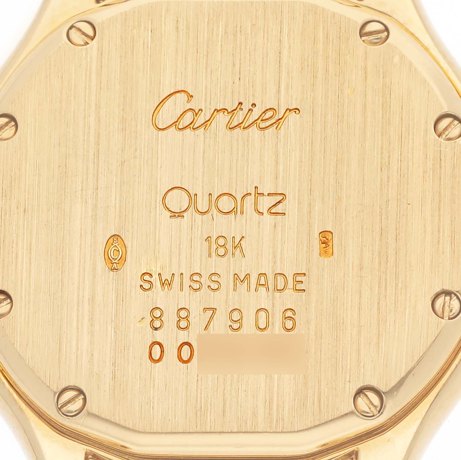 This image features the back of a Cartier Panthere 887906 Women's Yellow Gold Silver Dial 887906 Women's Yellow Gold Silver Dial model watch, displaying "Cartier," "Quartz," "18K," "Swiss Made," and the serial number.