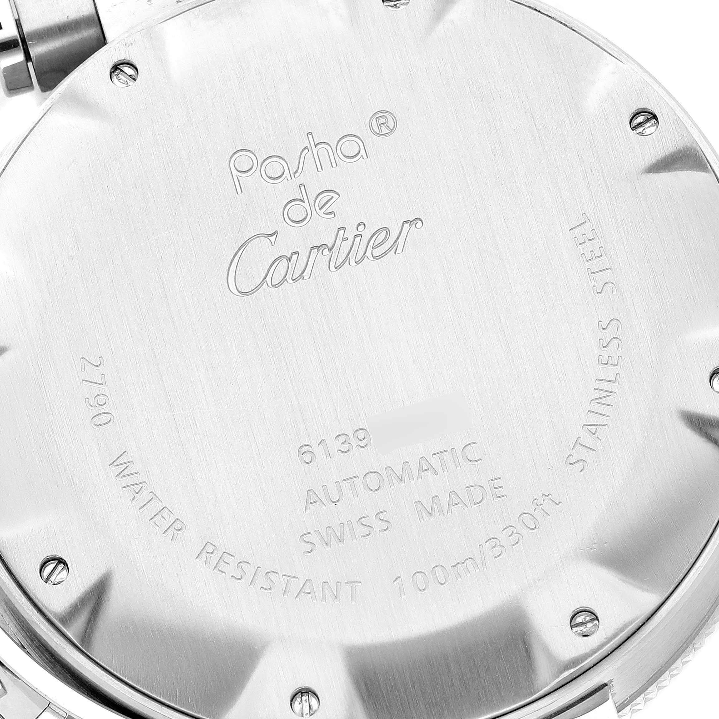 The image shows the back case of a Cartier Pasha W31077M7 Men
s Stainless Steel Black Dial W31077M7 Men
s Stainless Steel Black Dial watch, displaying model details and specifications engraved on it.