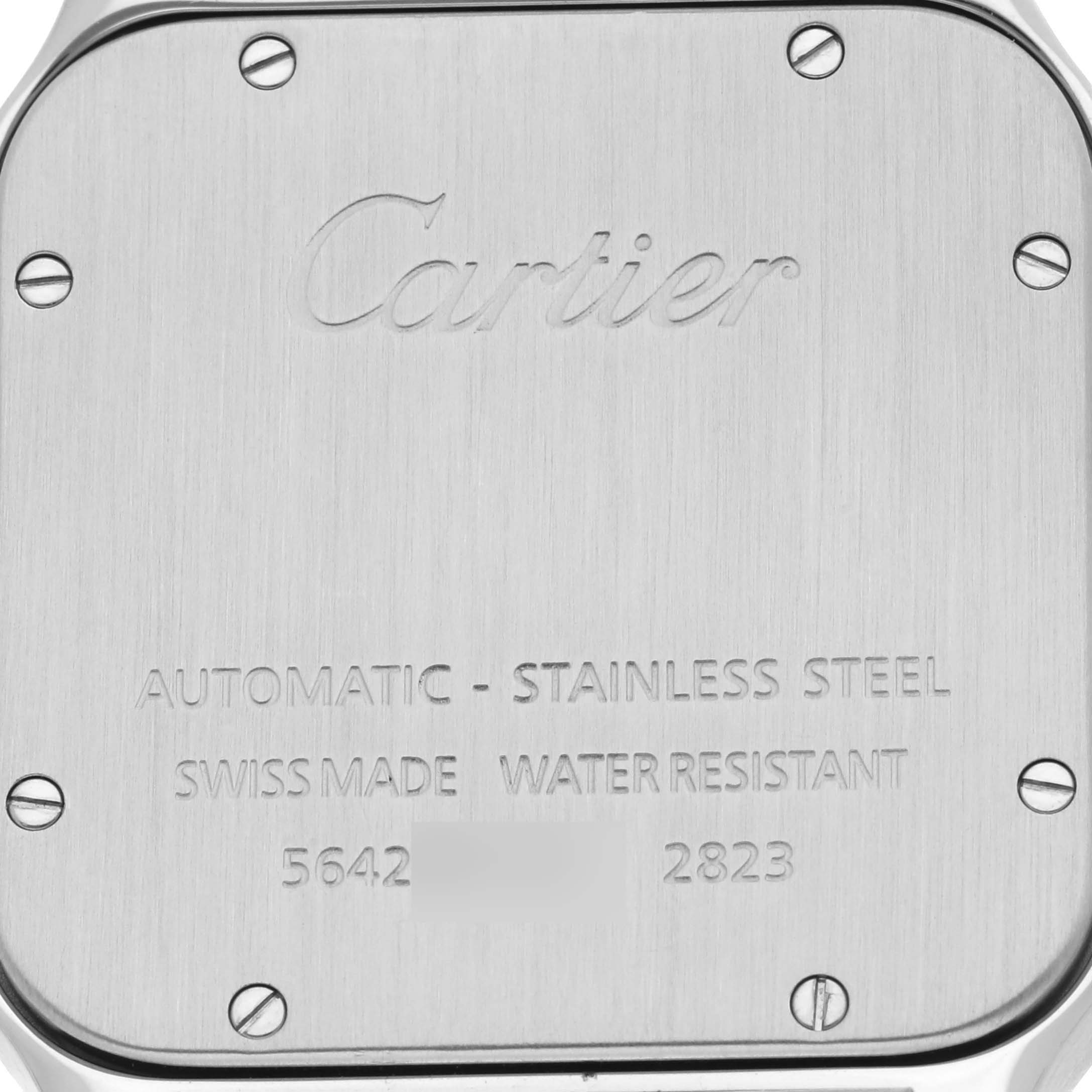 This image shows the brushed stainless steel case back of a Cartier Santos W20098D6 Men's Stainless Steel Silver Dial W20098D6 Men's Stainless Steel Silver Dial watch, with brand engraving and model details visible.