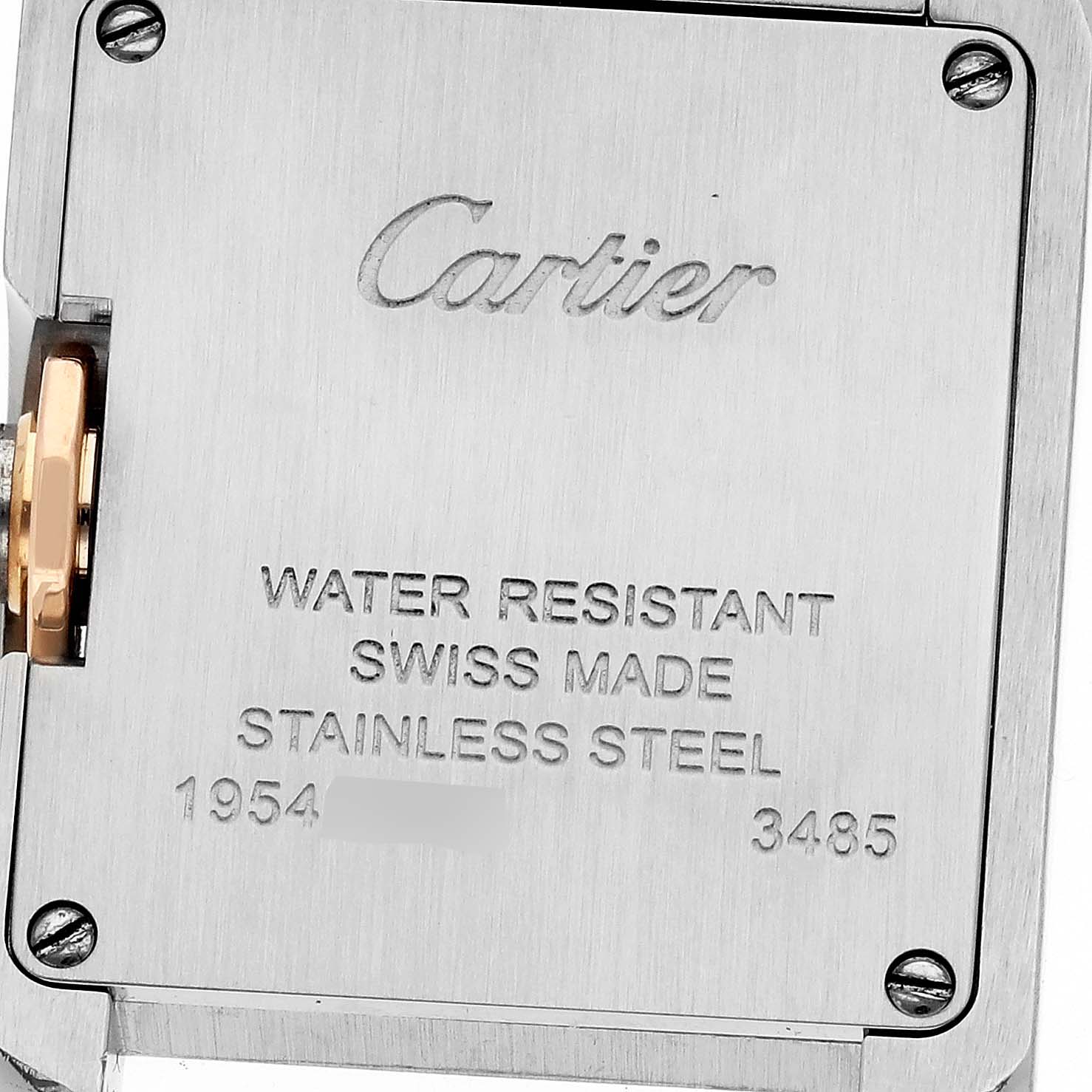 The image shows the back casing of a Cartier Tank Anglaise 60888 Women
s Steel and Gold (two tone) Silver Dial 60888 Women
s Steel and Gold (two tone) Silver Dial watch, highlighting the brand engraving and specifications.