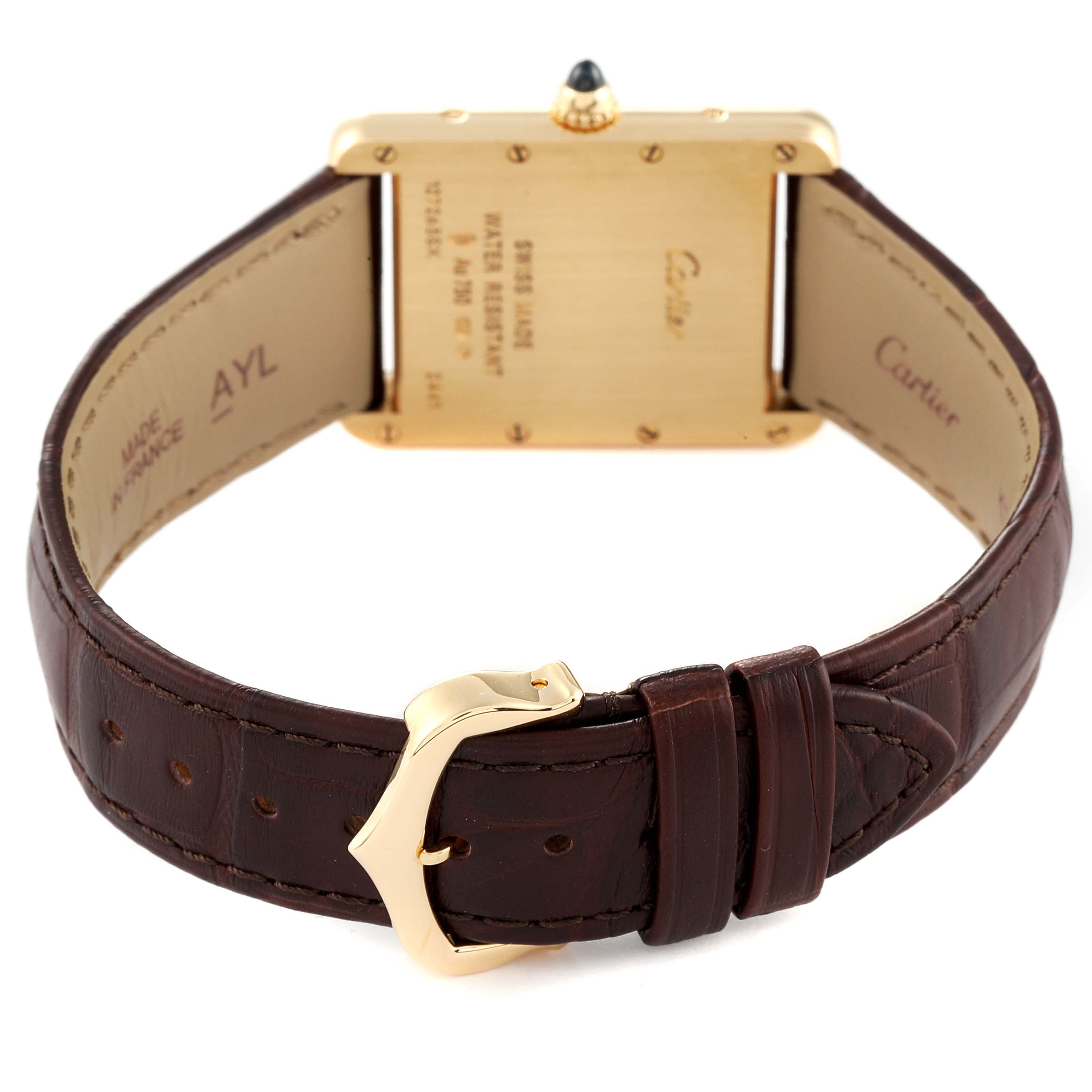 This image shows the back and buckle of a Tank Louis Cartier watch with a brown leather strap and gold details.