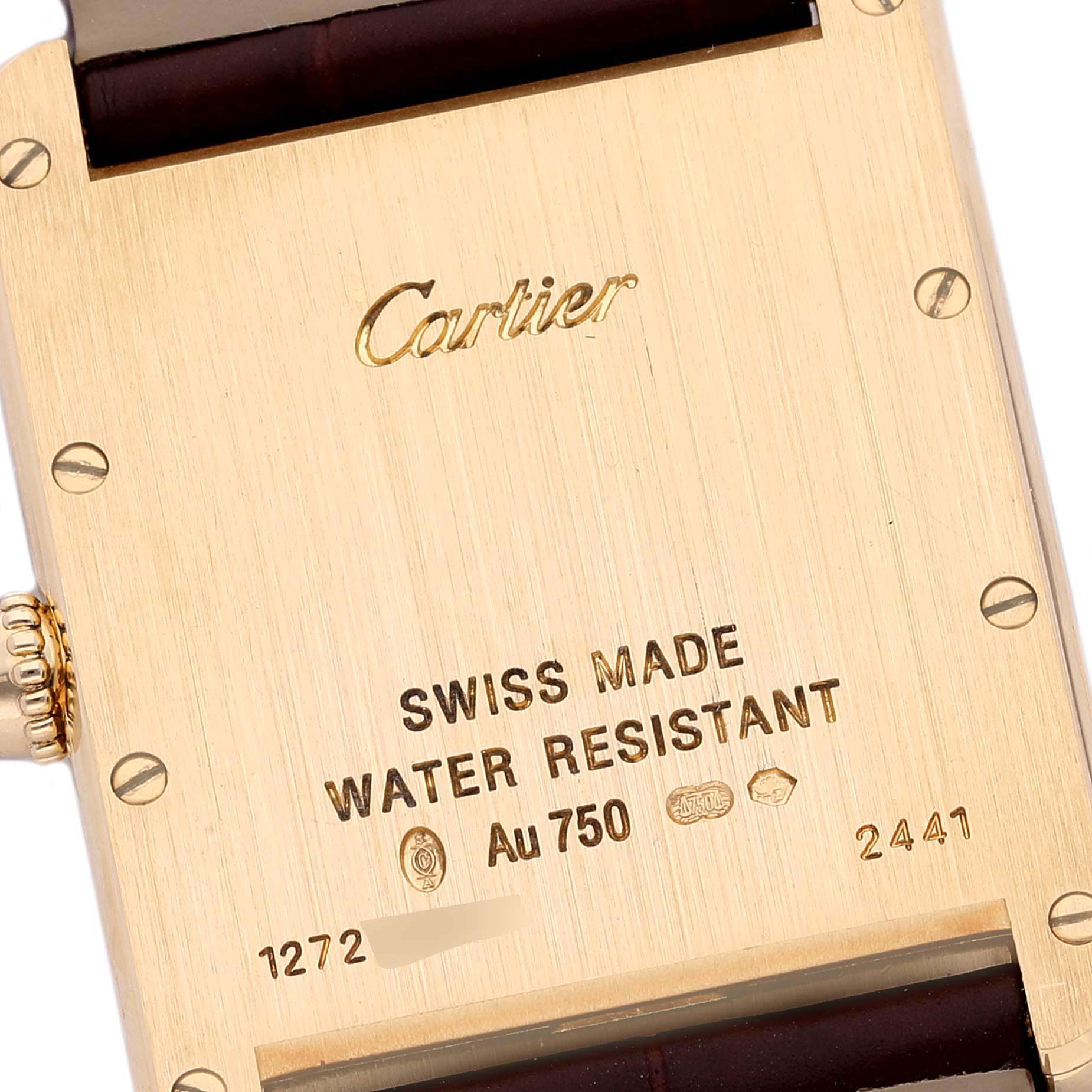 The image shows the back case and crown of a Cartier Tank Louis W1529756 Men
s Yellow Gold Silver Dial W1529756 Men
s Yellow Gold Silver Dial watch.