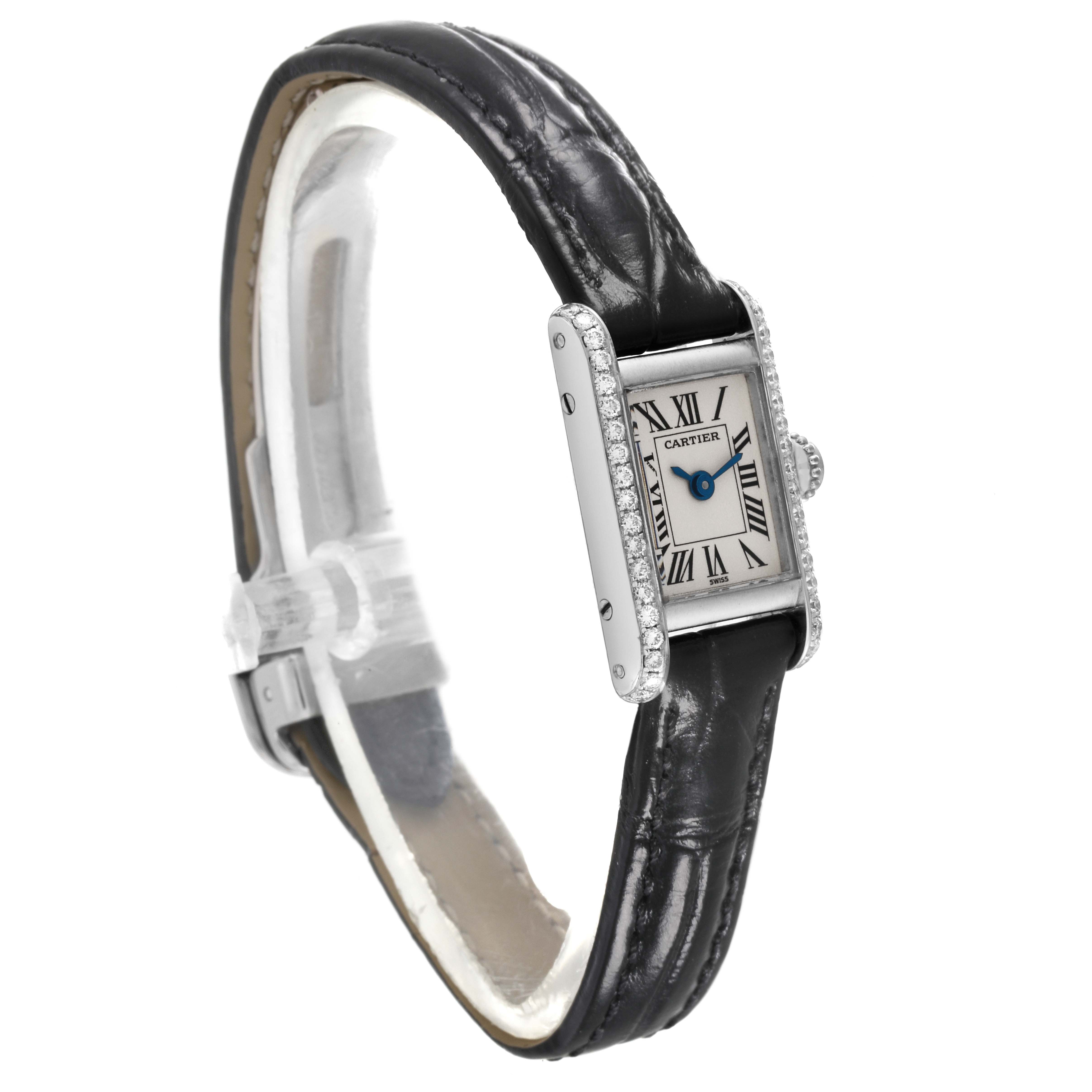 This is a side-angle view of the Cartier Tank Americaine 1371 Women's White Gold Silver Dial 1371 Women's White Gold Silver Dial watch, highlighting its black leather strap, rectangular face, and diamond-studded bezel.