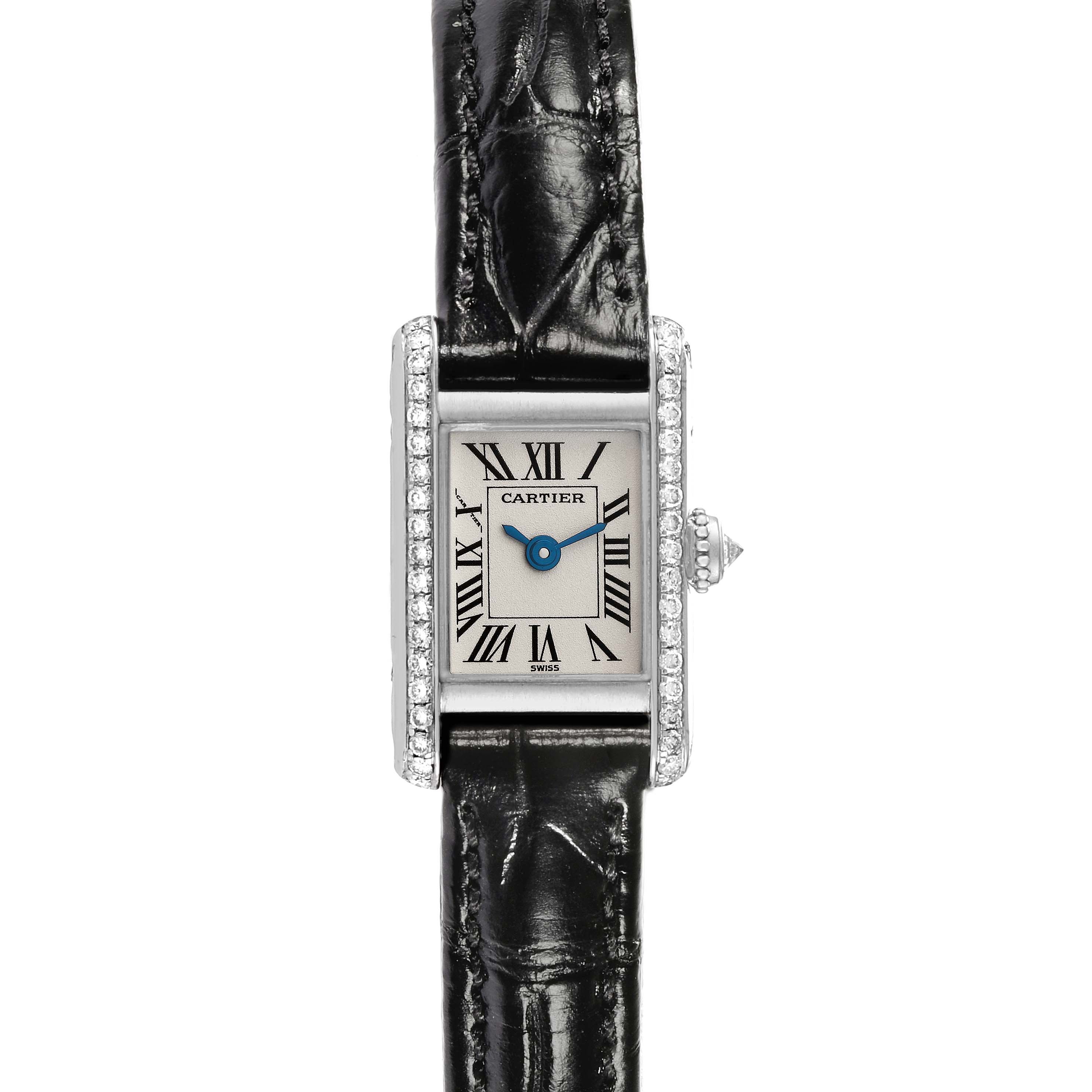 The image shows a frontal view of a Cartier Tank Américaine watch with a leather strap and diamond-encrusted bezel.
