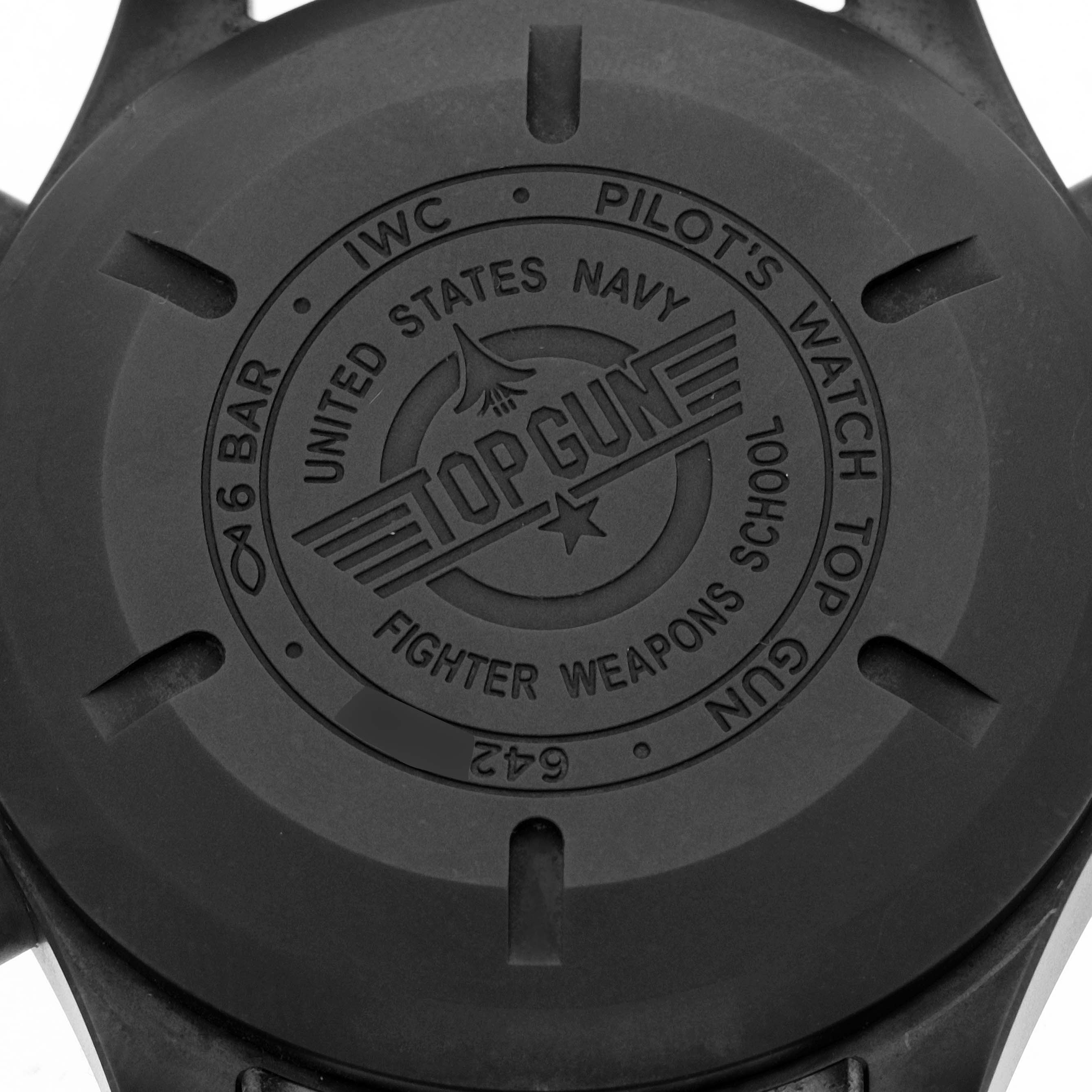 This image shows the back case of an IWC Pilot IW371815 Men's Titanium Black Dial IW371815 Men's Titanium Black Dial's Watch Top Gun model, featuring engraved details.