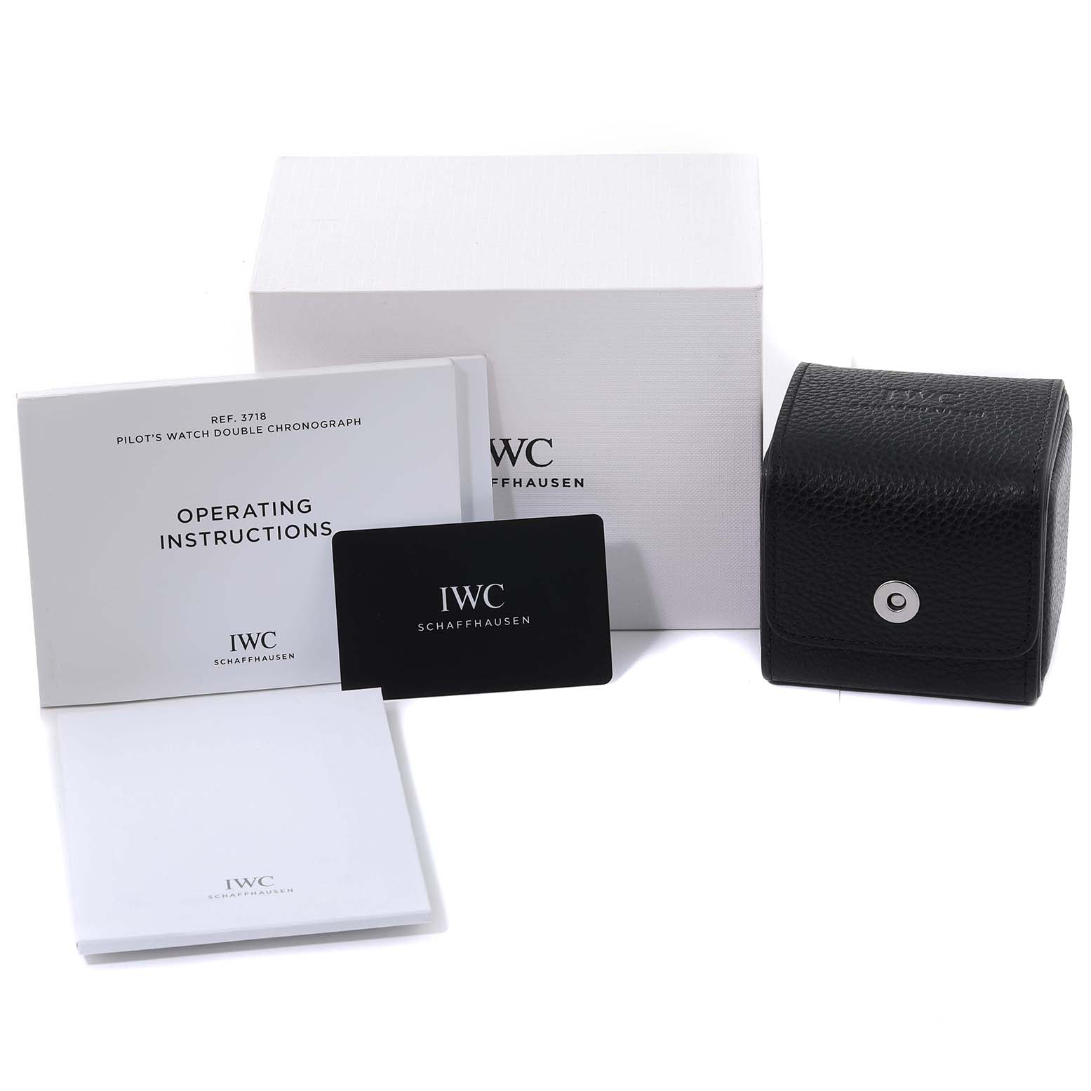 The image shows the box, operating instructions, warranty card, and carrying case for an IWC Pilot IW371815 Men's Titanium Black Dial IW371815 Men's Titanium Black Dial model watch.