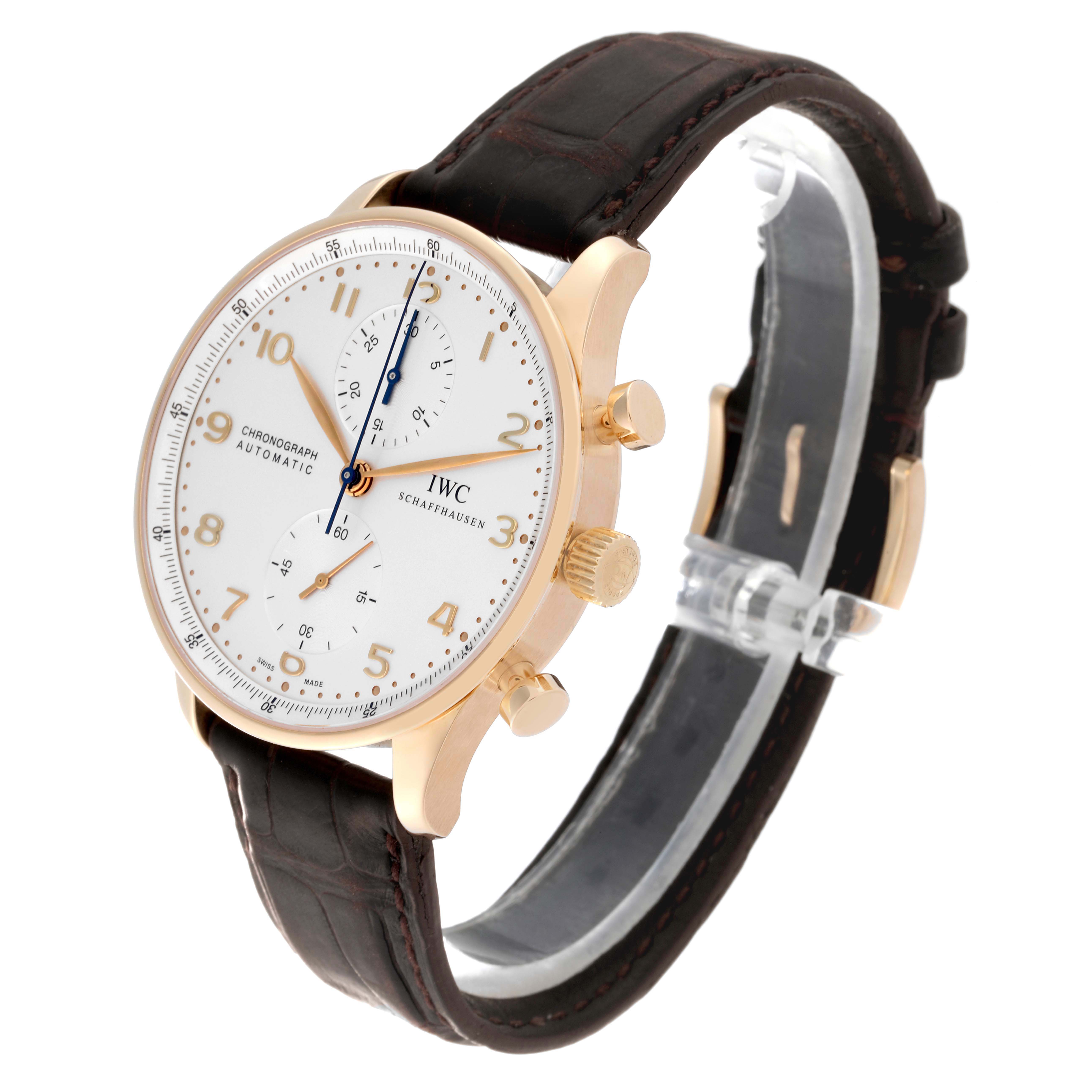 This IWC Portuguese IW371402 Men's Rose Gold Silver Dial IW371402 Men's Rose Gold Silver Dial watch is shown at a three-quarter angle, featuring its face, crown, pushers, and leather strap.