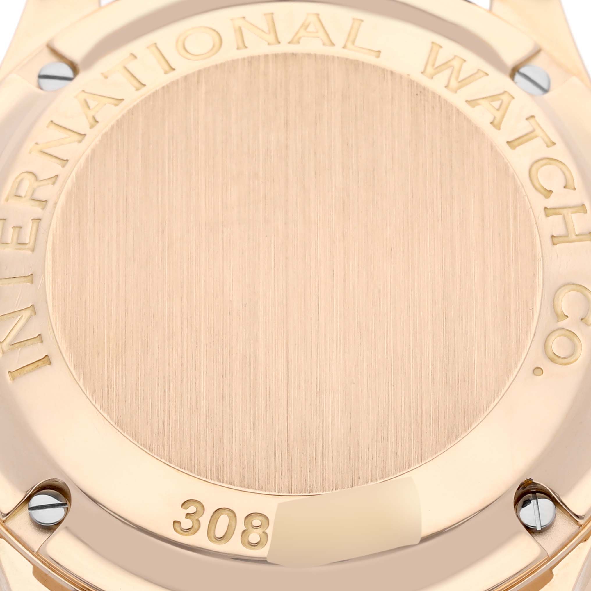 The image shows the case back of an IWC Portuguese IW371402 Men's Rose Gold Silver Dial IW371402 Men's Rose Gold Silver Dial model watch, highlighting the brand engraving and screws.