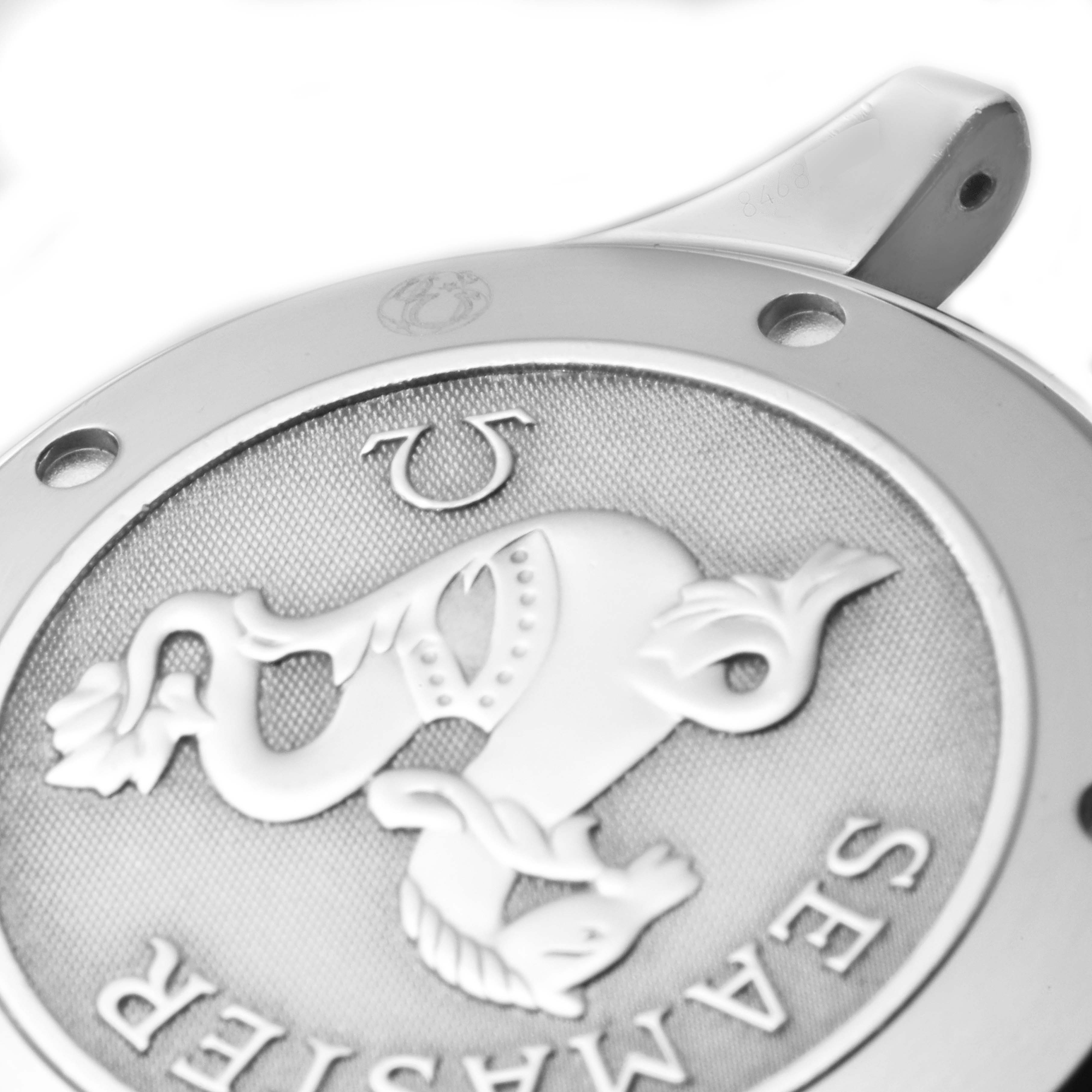 The image shows a close-up of the case back of an Omega Seamaster 212.30.41.20.01.002 Men's Stainless Steel Black Dial 212.30.41.20.01.002 Men's Stainless Steel Black Dial watch, highlighting the embossed logo and engravings.