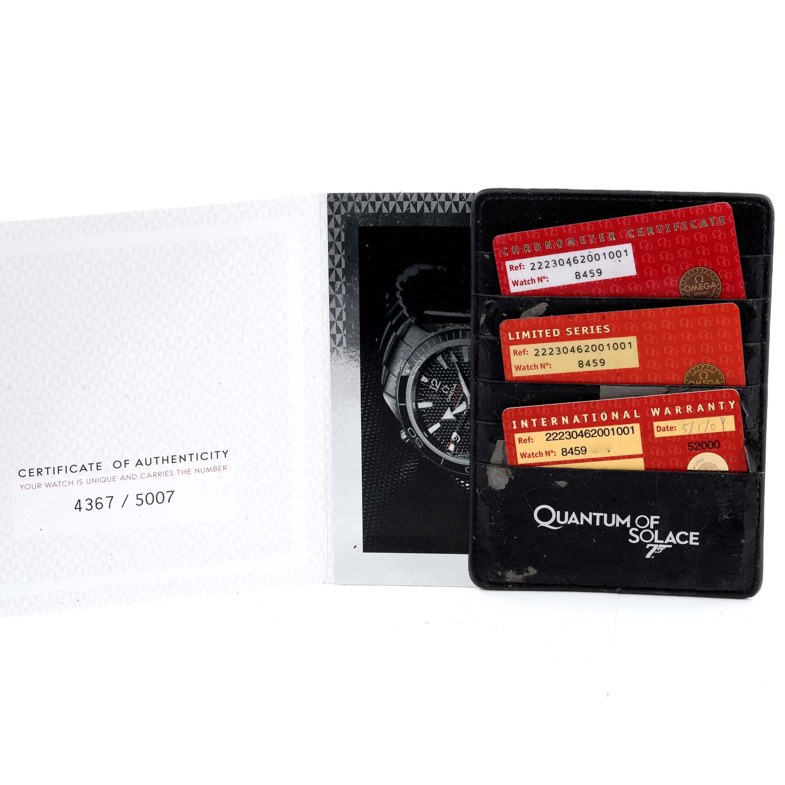 The image shows authenticity cards and a booklet for the Omega Planet Ocean 222.30.46.20.01.001 Men's Stainless Steel Black Dial 222.30.46.20.01.001 Men's Stainless Steel Black Dial model, displayed from a top angle.