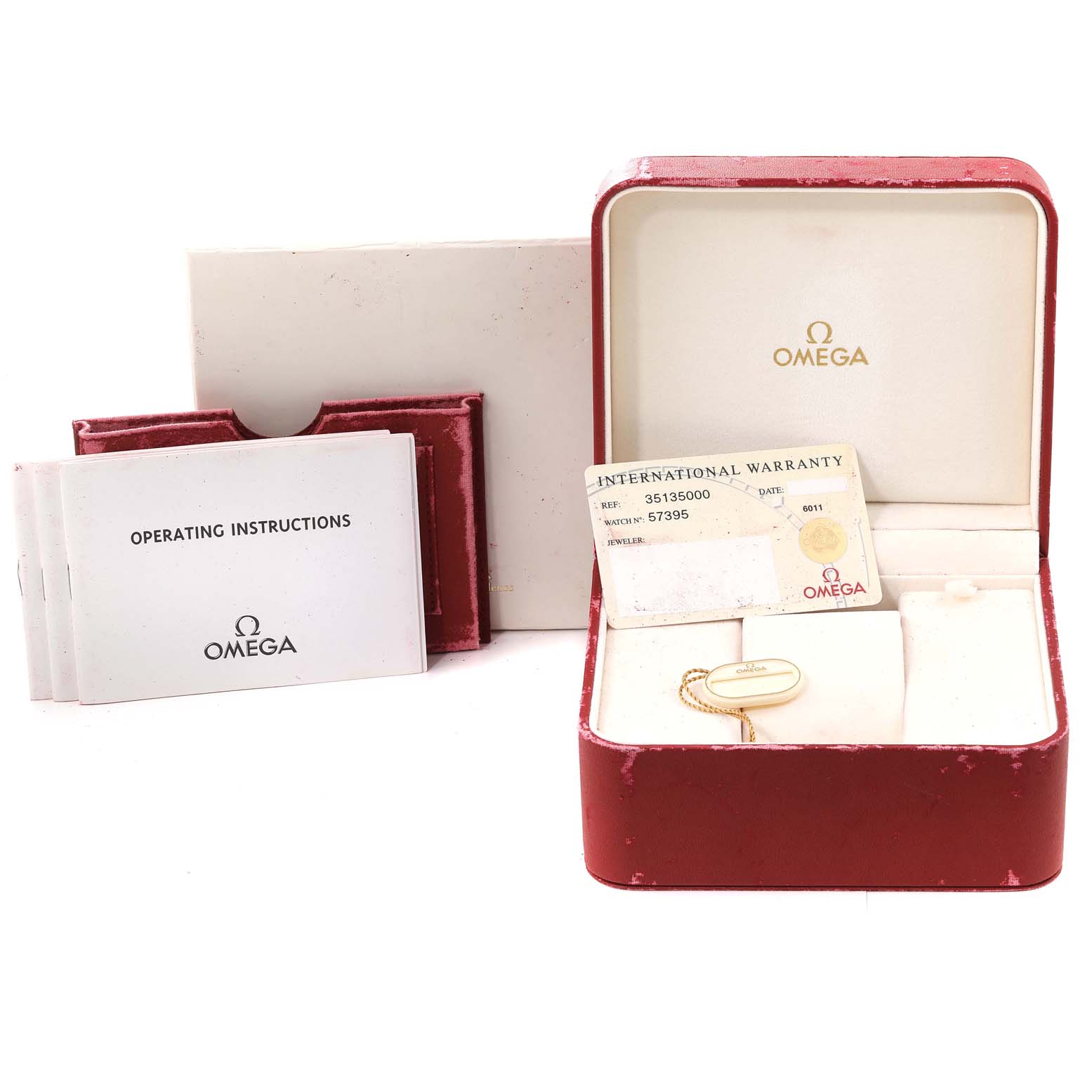 The image shows an Omega Speedmaster 3513.50.00 Men
s Stainless Steel Black Dial 3513.50.00 Men
s Stainless Steel Black Dial box, operating instructions, an international warranty card, and a tag.