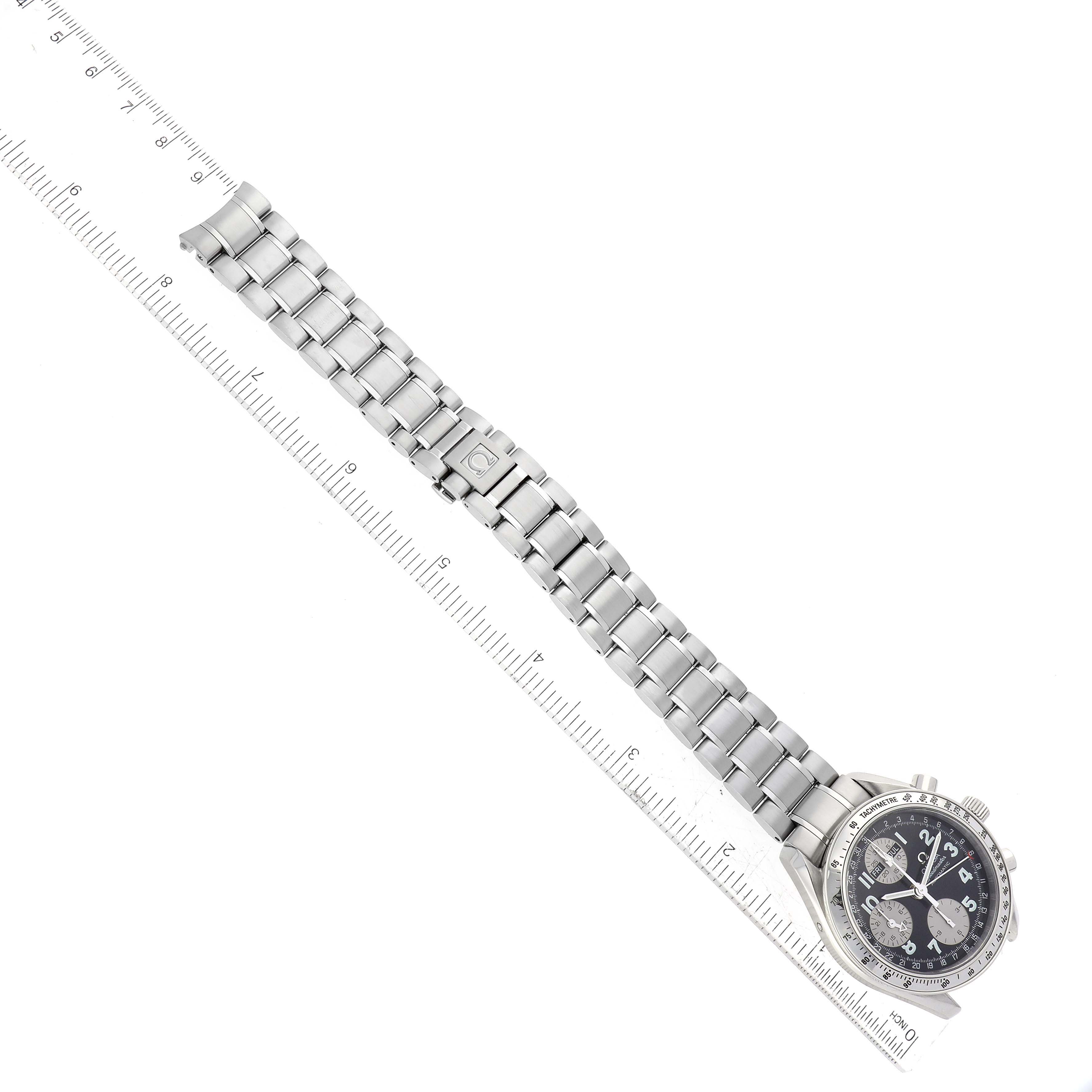 The image shows an overhead view of an Omega Speedmaster 3523.51.00 Men
s Stainless Steel Black Dial 3523.51.00 Men
s Stainless Steel Black Dial watch, displaying the full length of its metal bracelet and dial.