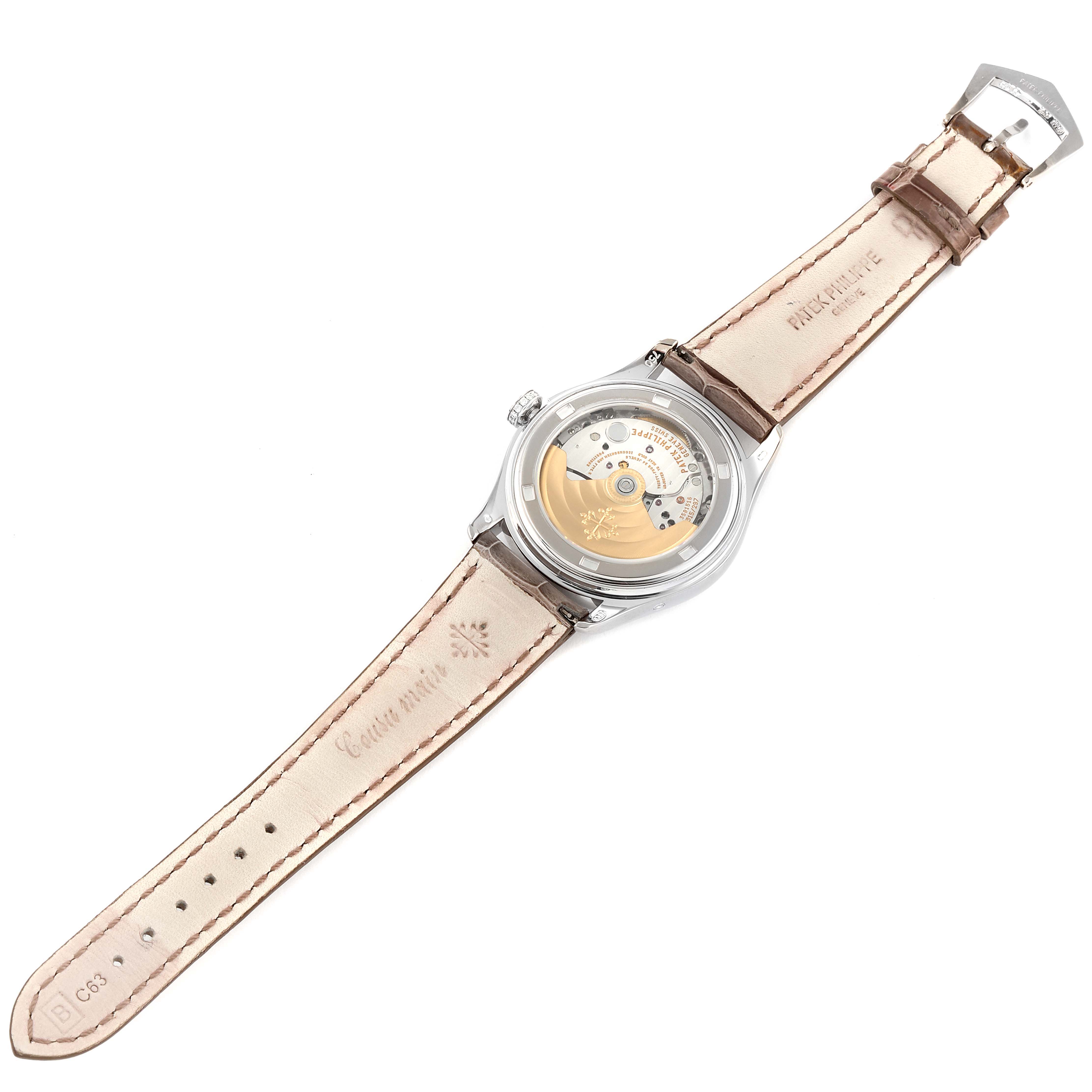 The image shows the back and the interior mechanical movement of the Patek Philippe Complications 4936G - 001 Men's White Gold Mother of Pearl Dial 4936G - 001 Men's White Gold Mother of Pearl Dial model watch.