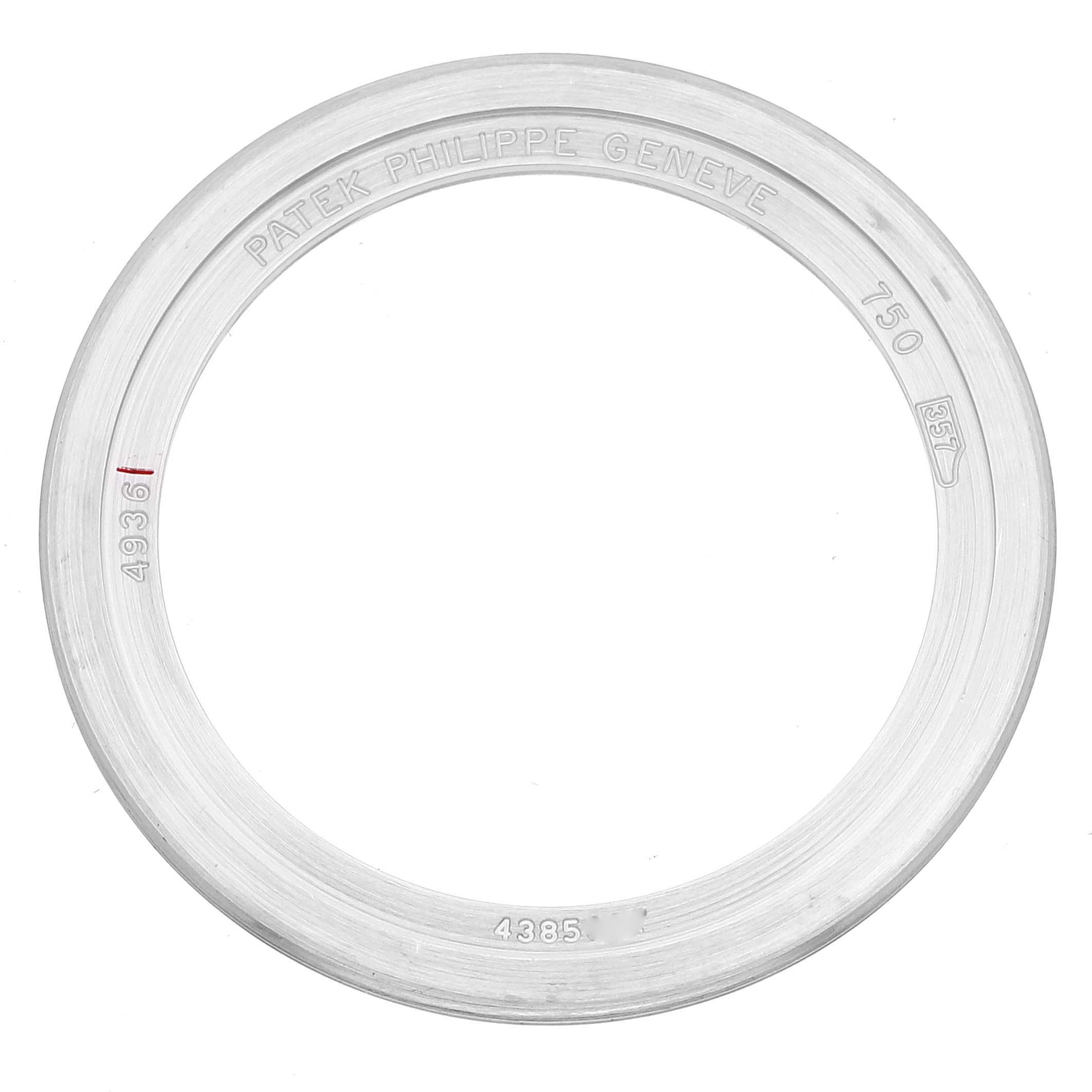 This image shows a watch bezel for the Complications model by Patek Philippe, viewed from the front.