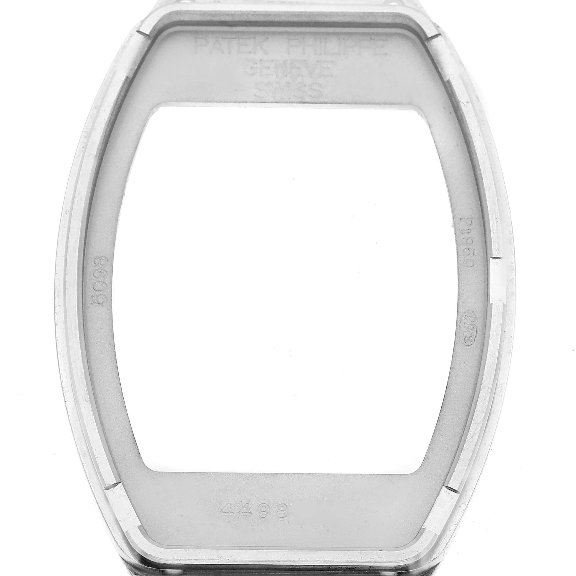 The image shows the casing of a Patek Philippe Gondolo 5098P Men
s Platinum Silver Dial 5098P Men
s Platinum Silver Dial watch, highlighting its bezel and interior markings.