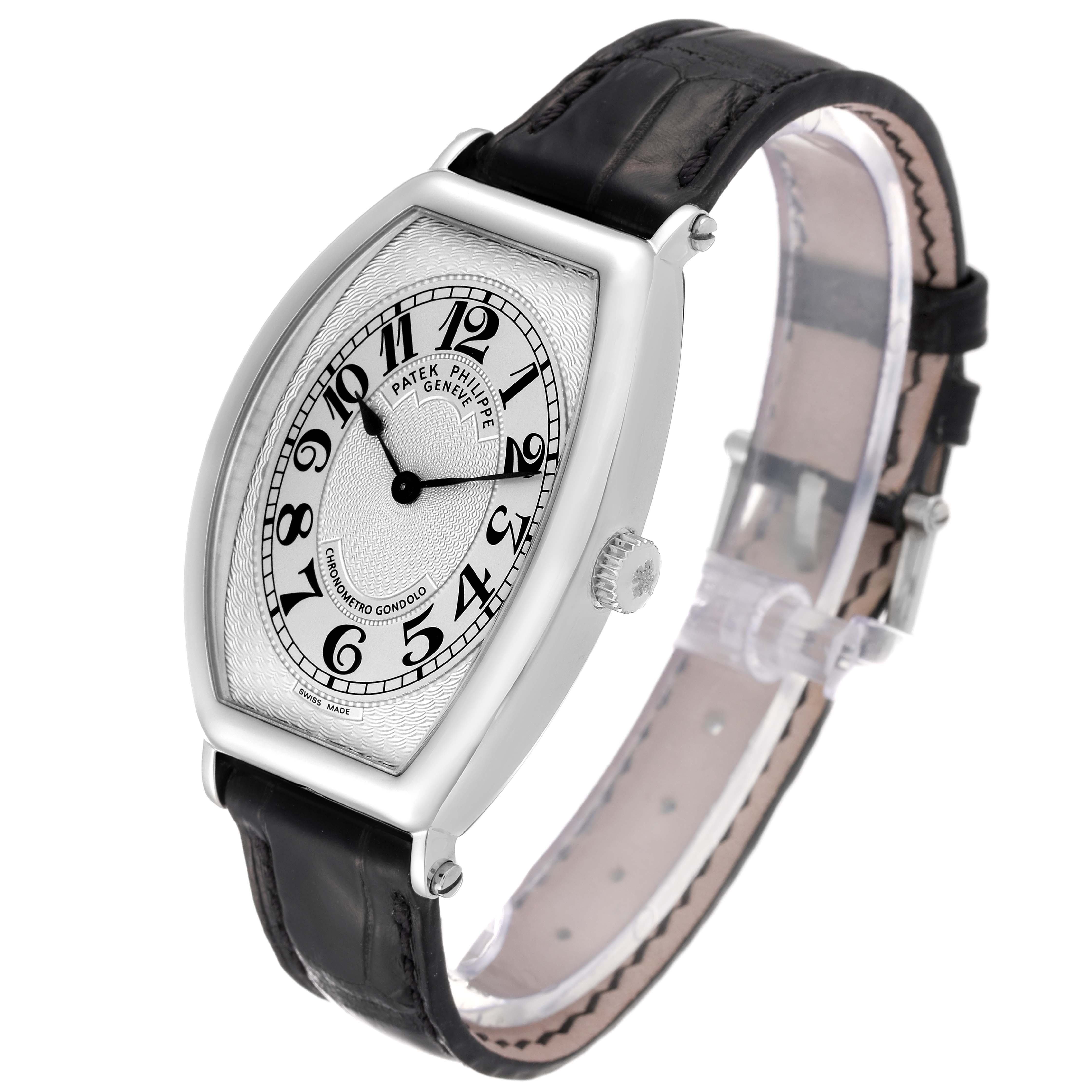 The image shows a Patek Philippe Gondolo 5098P Men
s Platinum Silver Dial 5098P Men
s Platinum Silver Dial watch at a three-quarter angle, displaying its dial, case, crown, and leather strap.