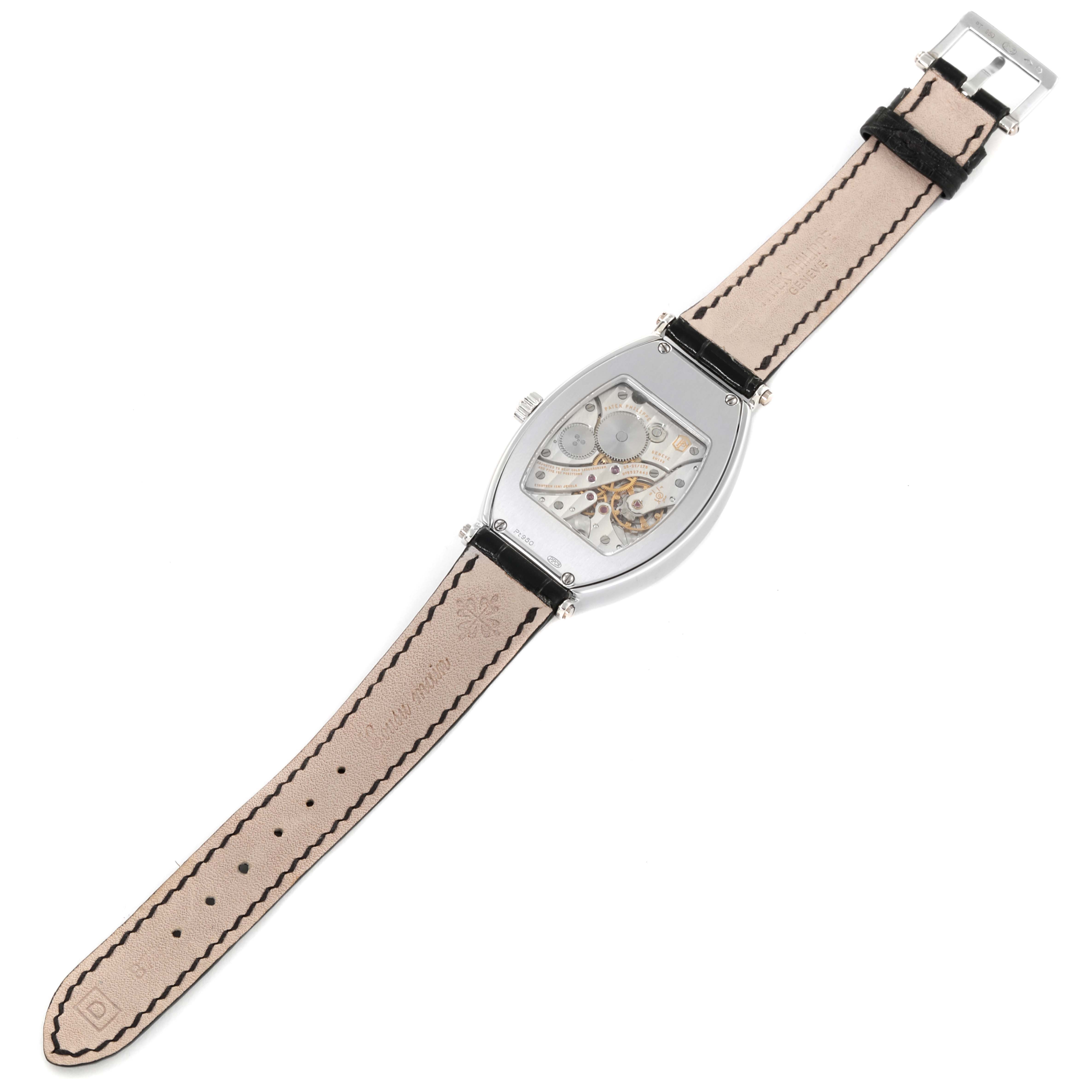 The image shows the back view of a Patek Philippe Gondolo 5098P Men
s Platinum Silver Dial 5098P Men
s Platinum Silver Dial watch, displaying its movement and leather strap.