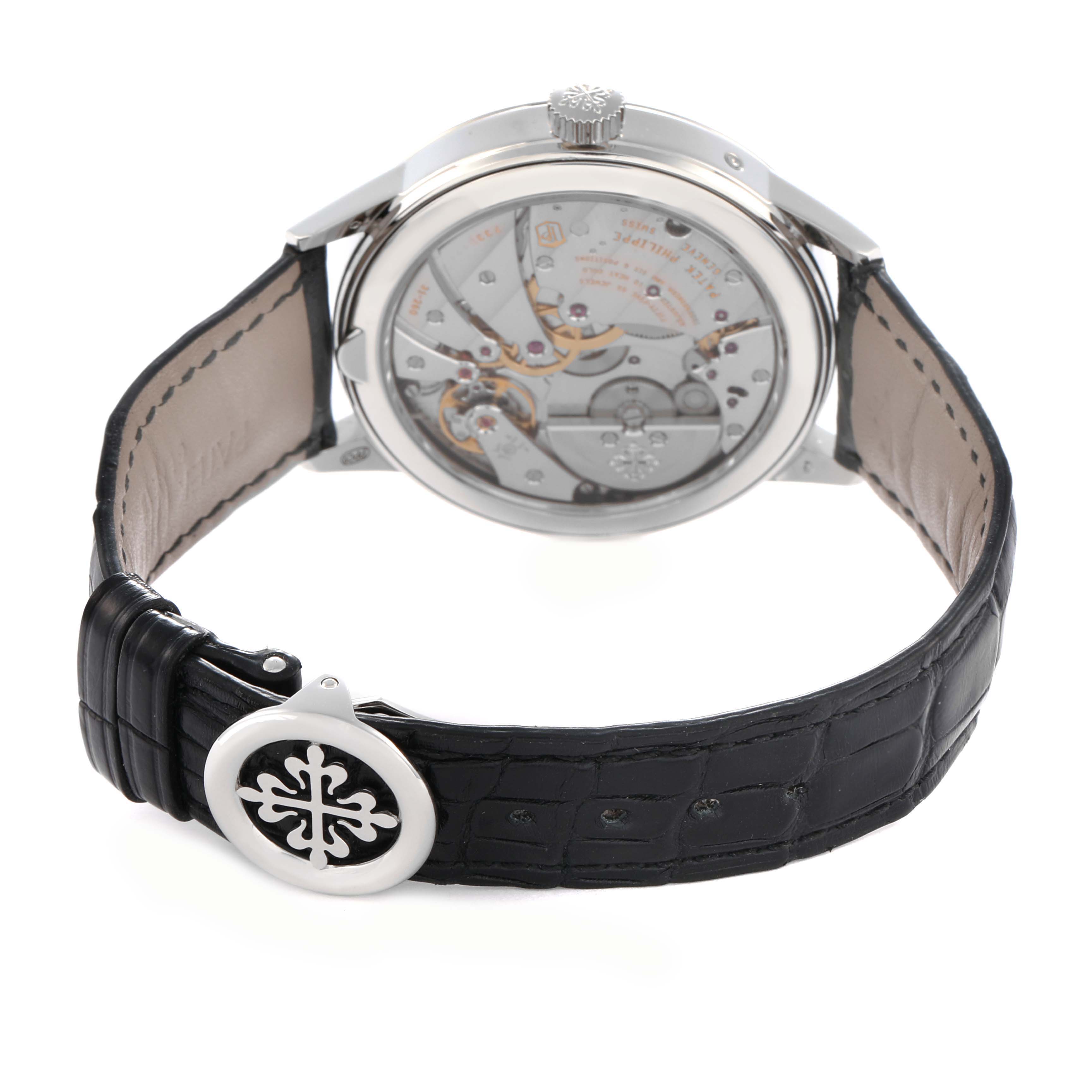 The image shows the back view of the Patek Philippe Complications 5236P Men's Platinum Blue Dial model, highlighting the movement and the closed leather strap.