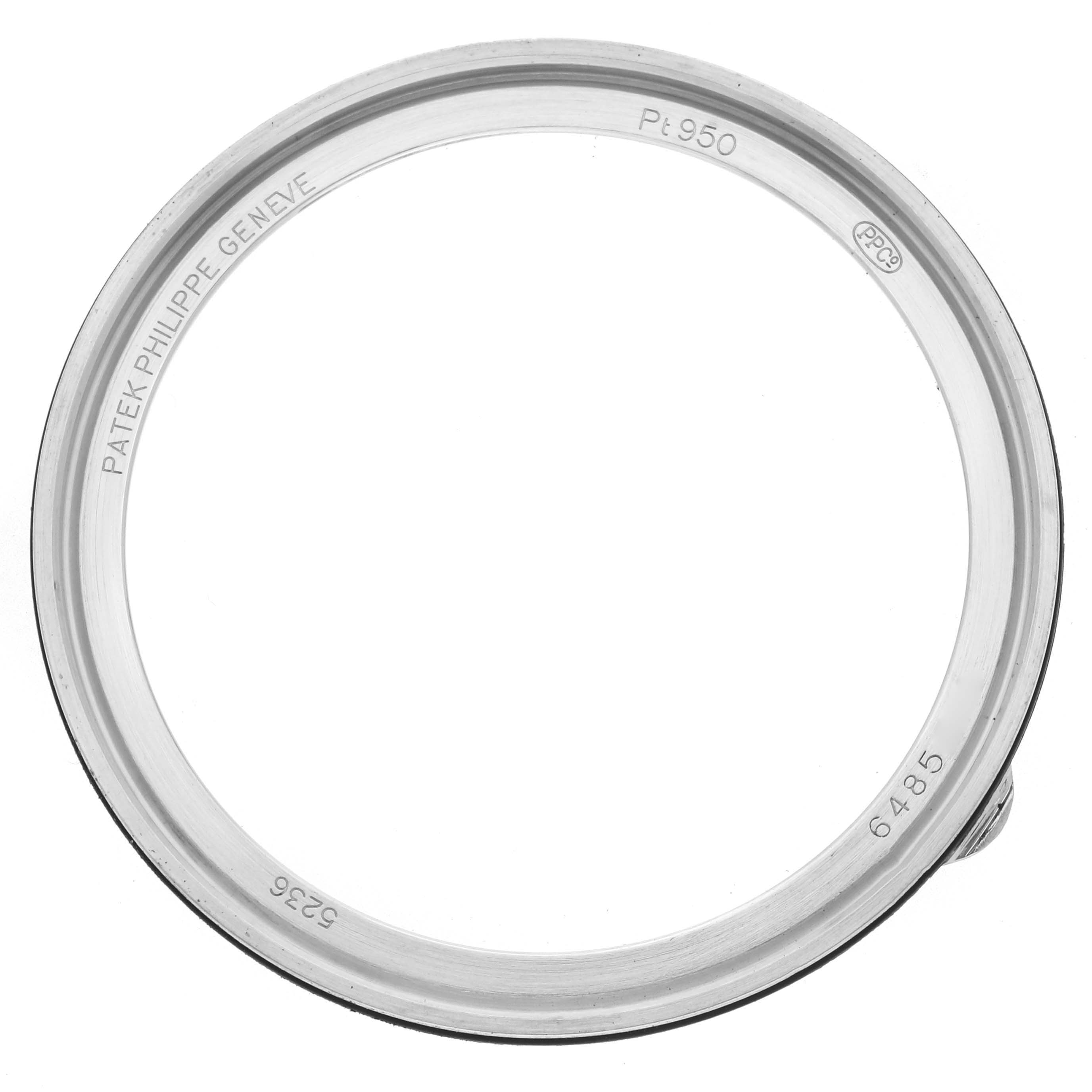 This image shows the bezel of a Patek Philippe Complications 5236P Men's Platinum Blue Dial watch, viewed from above.