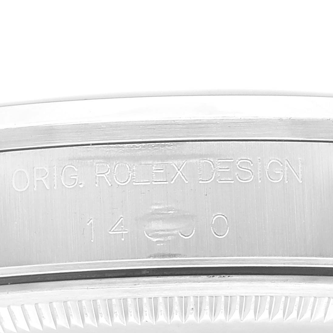 This image shows a close-up of the side engraving on the case of a Rolex Air-King 14000 Men's Stainless Steel Blue Dial 14000 Men's Stainless Steel Blue Dial watch, displaying "ORIG. ROLEX DESIGN" and model number.
