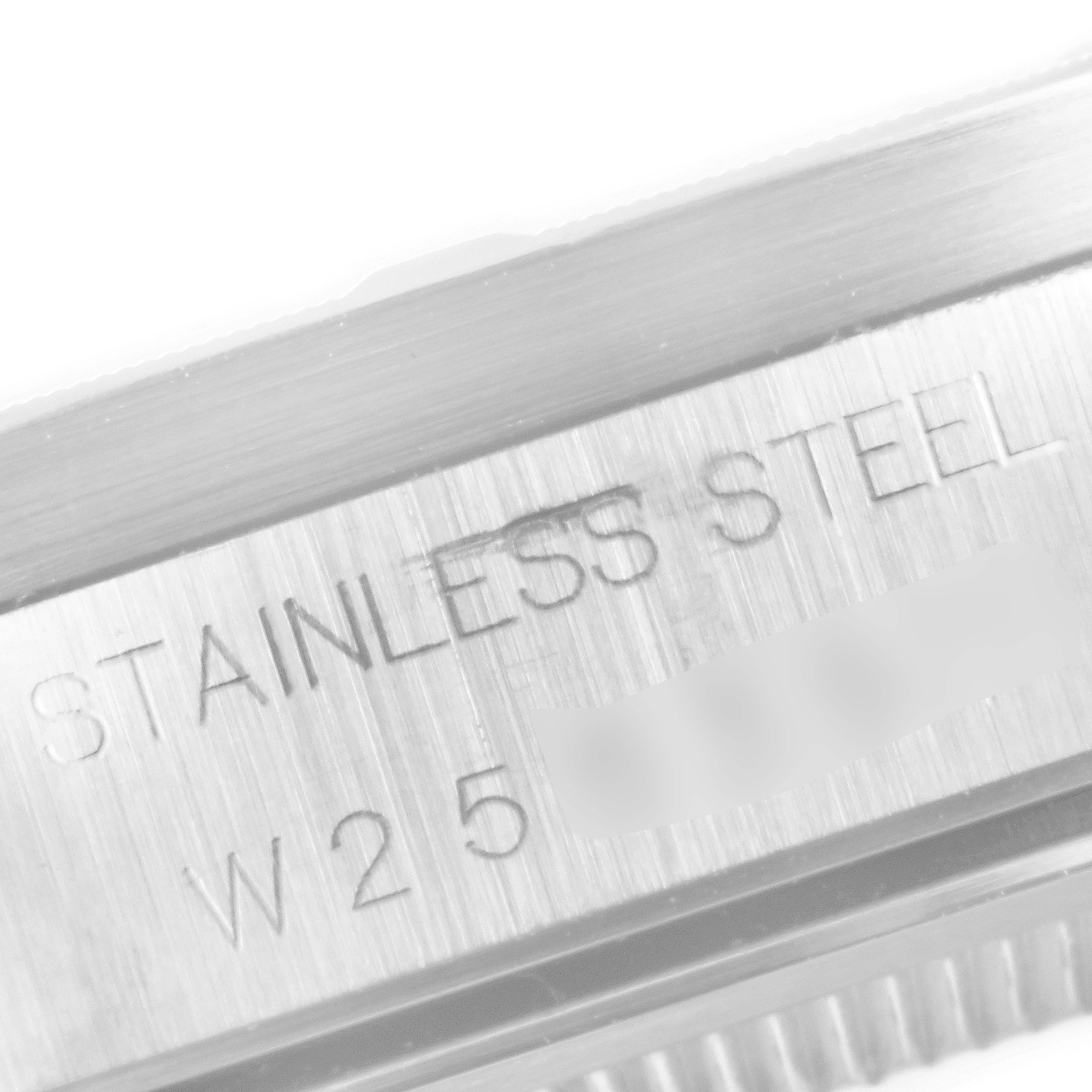 This image shows a close-up of the side case of a Rolex Air-King 14010 Men's Stainless Steel Blue Dial 14010 Men's Stainless Steel Blue Dial watch, highlighting the "STAINLESS STEEL" engraved text.