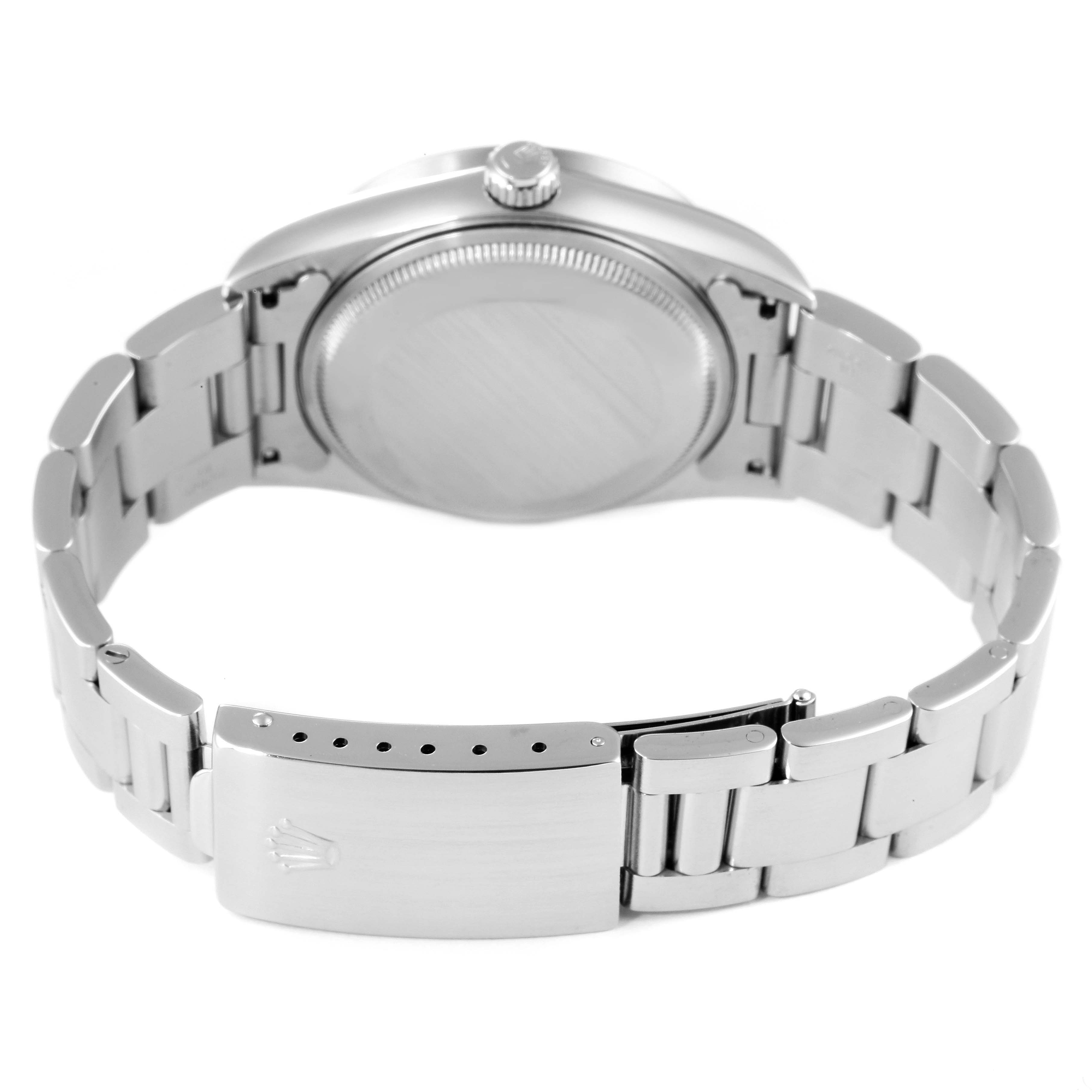 The Rolex Air-King 14010 Men's Stainless Steel Blue Dial 14010 Men's Stainless Steel Blue Dial watch is shown from the back, displaying its case back, crown, and bracelet with the clasp partially open.