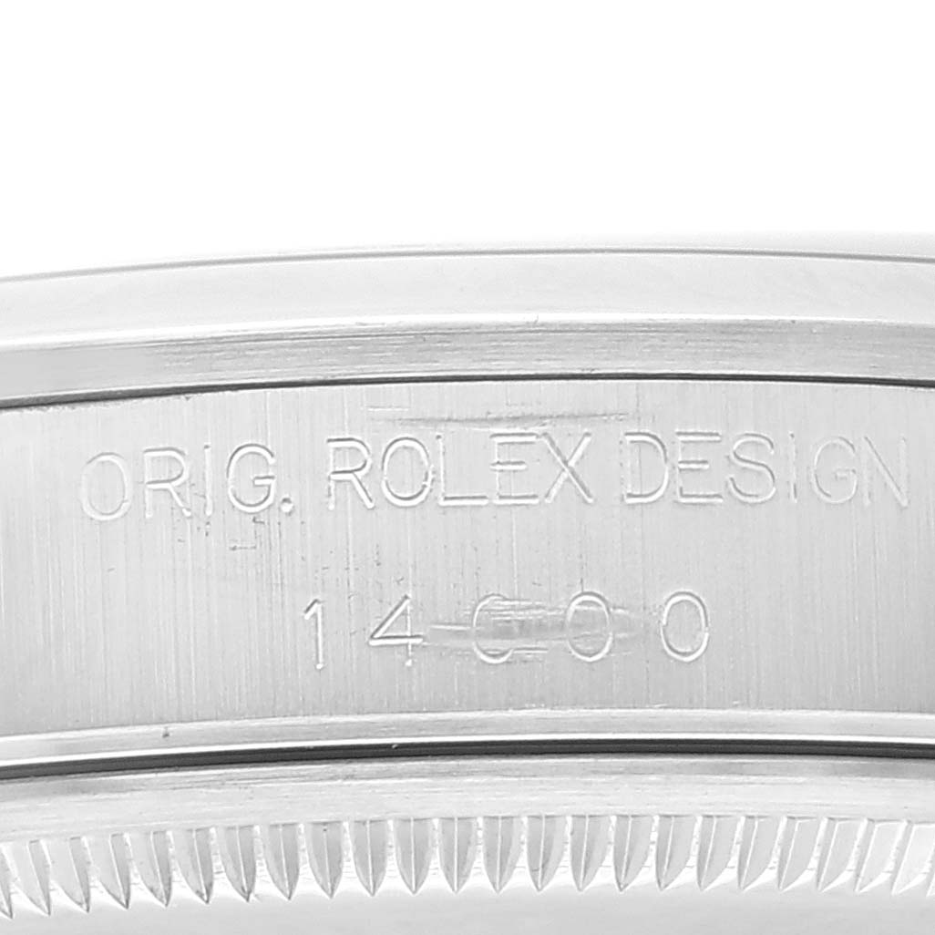 This image shows a close-up of the side of a Rolex Air-King 14000 Men's Stainless Steel Silver Dial 14000 Men's Stainless Steel Silver Dial watch case, highlighting the engraved model number and design text.