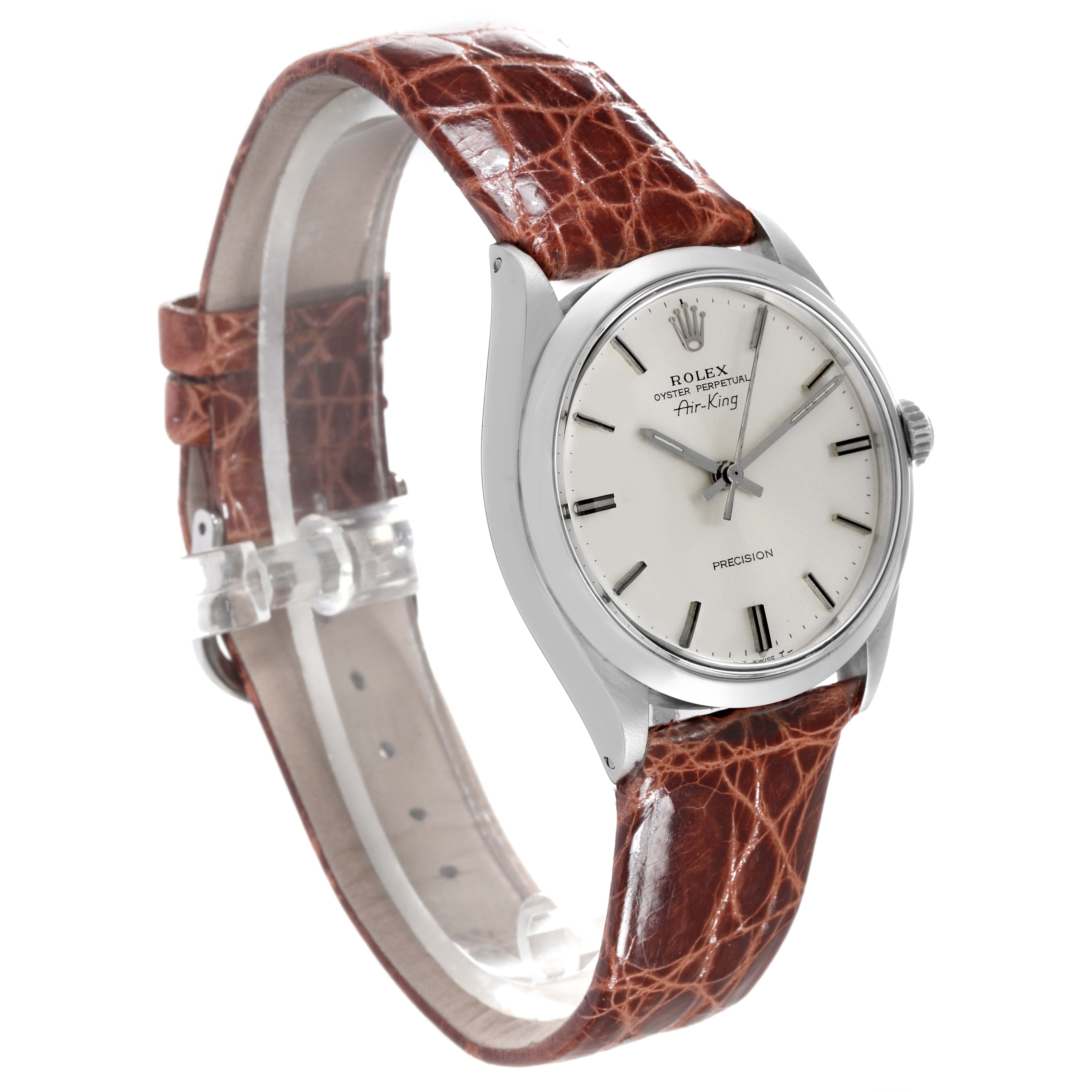 The Rolex Vintage Collection 5500 Men's Stainless Steel Silver Dial 5500 Men's Stainless Steel Silver Dial Air-King watch is shown at an angled side view, displaying the dial, case, and leather strap.