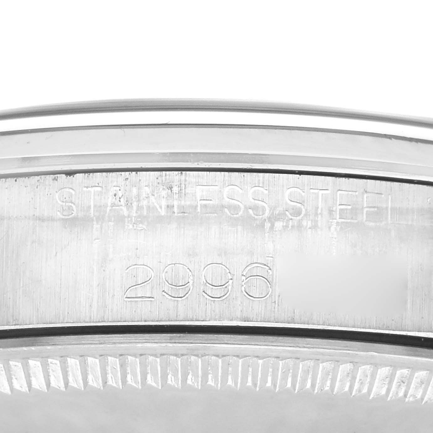 The image shows a close-up of the side of a Rolex Vintage Collection 5500 Men's Stainless Steel Silver Dial 5500 Men's Stainless Steel Silver Dial watch case, highlighting the stainless steel marking and a partial serial number.