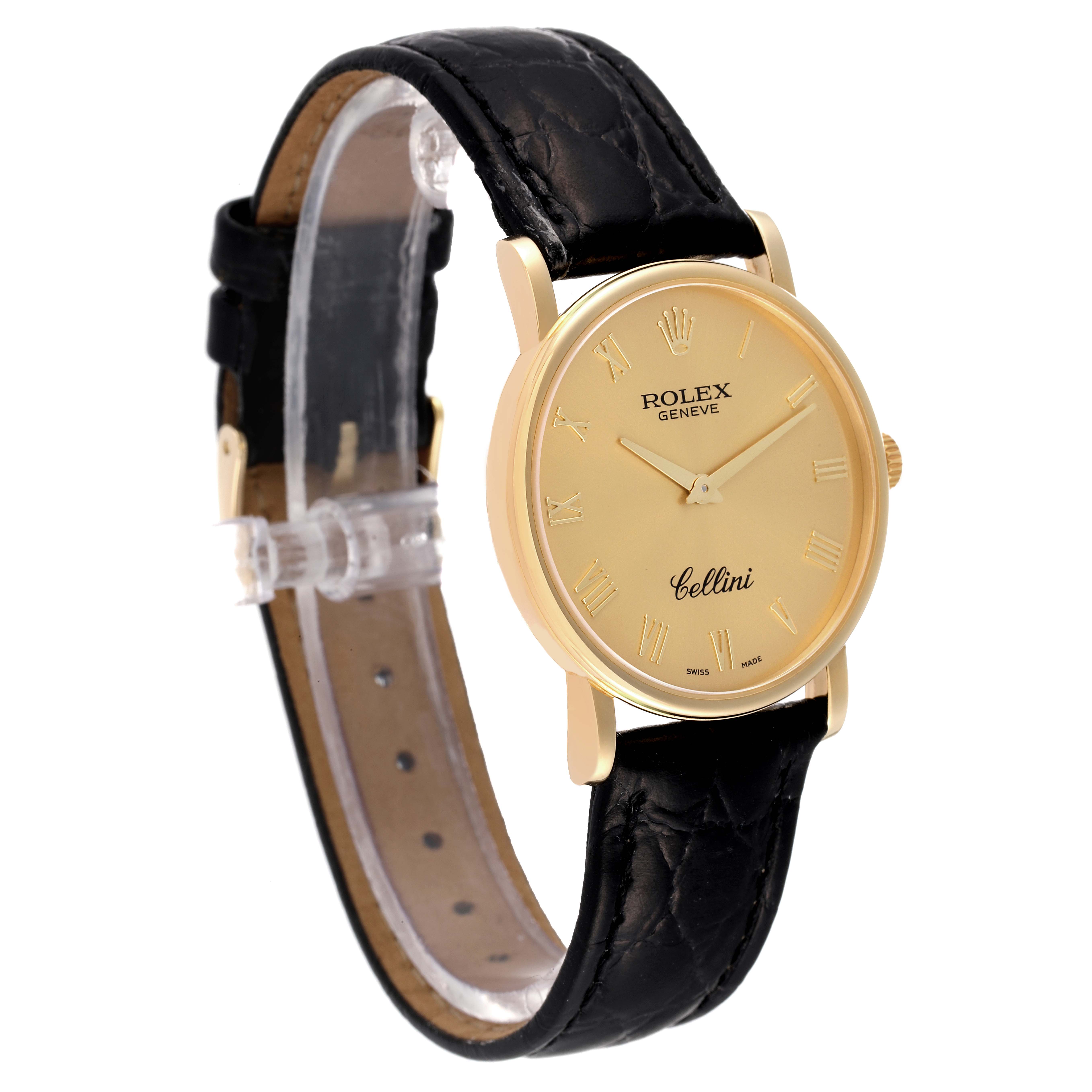 The image shows a Rolex Cellini 5115 Men's Yellow Gold Champagne Dial 5115 Men's Yellow Gold Champagne Dial watch from a front angle, highlighting its gold face, black leather strap, and Roman numeral markers.